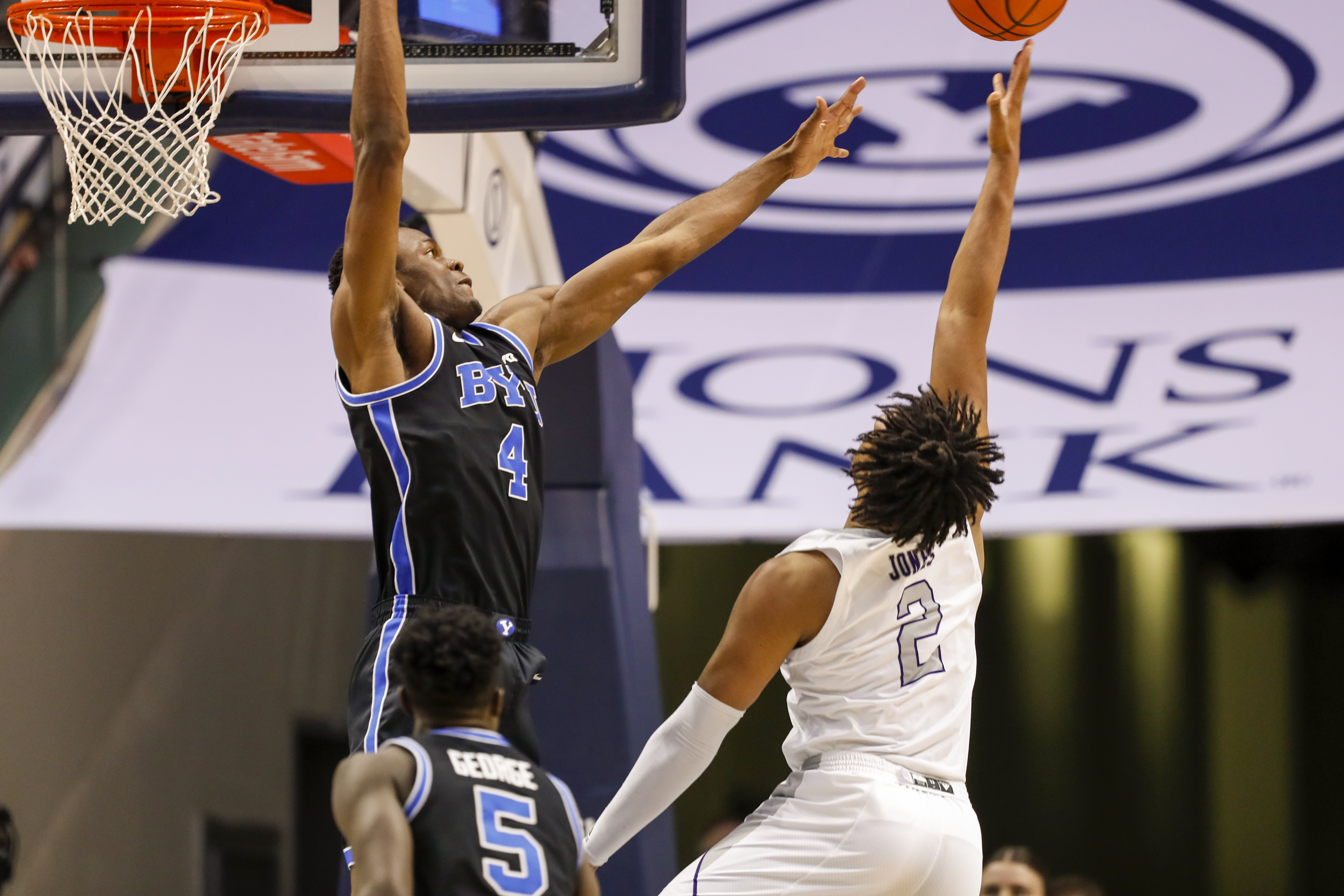 Weber State forward Dillon Jones goes for a layup while BYU forward Atiki Ally Atiki defends in Provo on Thursday, Dec. 22, 2022. BYU won 63-57.