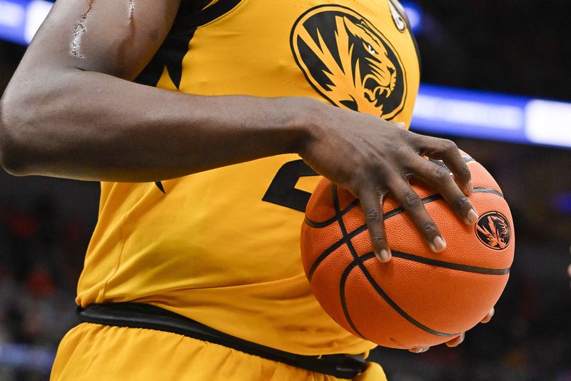 Dec 22, 2022; St. Louis, Missouri, USA;  Missouri Tigers guard Kobe Brown (24) holds the basketball during the second half against the Illinois Fighting Illini at Enterprise Center.