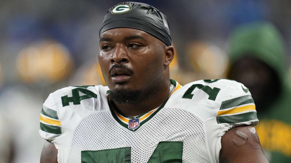 FILE - Green Bay Packers guard Elgton Jenkins (74) watches during an NFL football game against the Detroit Lions in Detroit, Sunday, Nov. 6, 2022. A person familiar with the situation says Green Bay Packers offensive lineman Elgton Jenkins has agreed to a four-year contract extension worth at least $68 million.