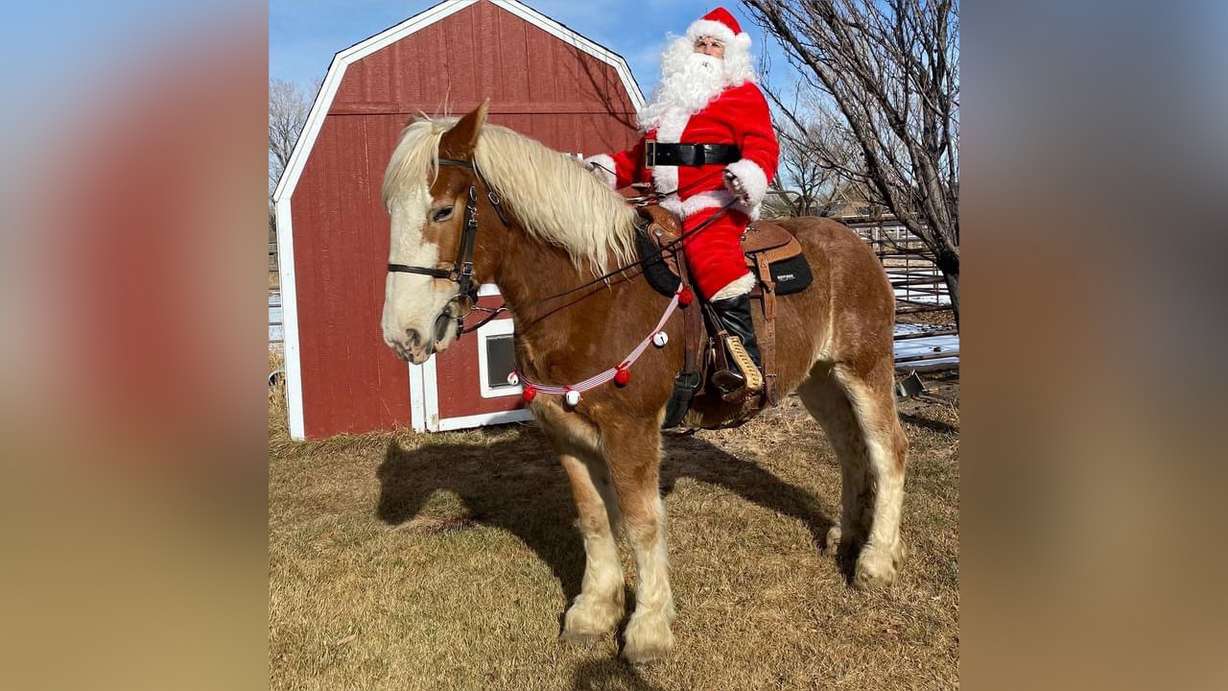 Tiffany Ulmer of Eagle Mountain, dresses up as Santa to spread Christmas cheer throughout the tight-knit community.