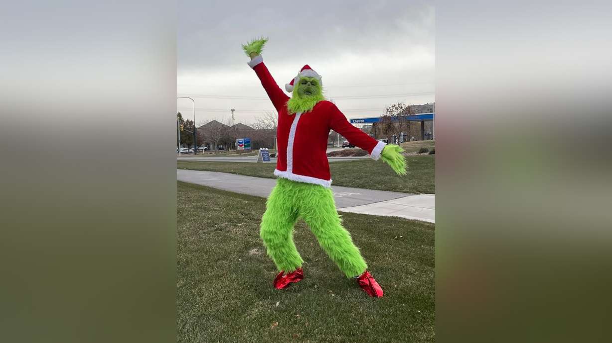Michael Johnson, of Eagle Mountain, dresses as the Grinch every year to spread holiday cheer throughout his community.