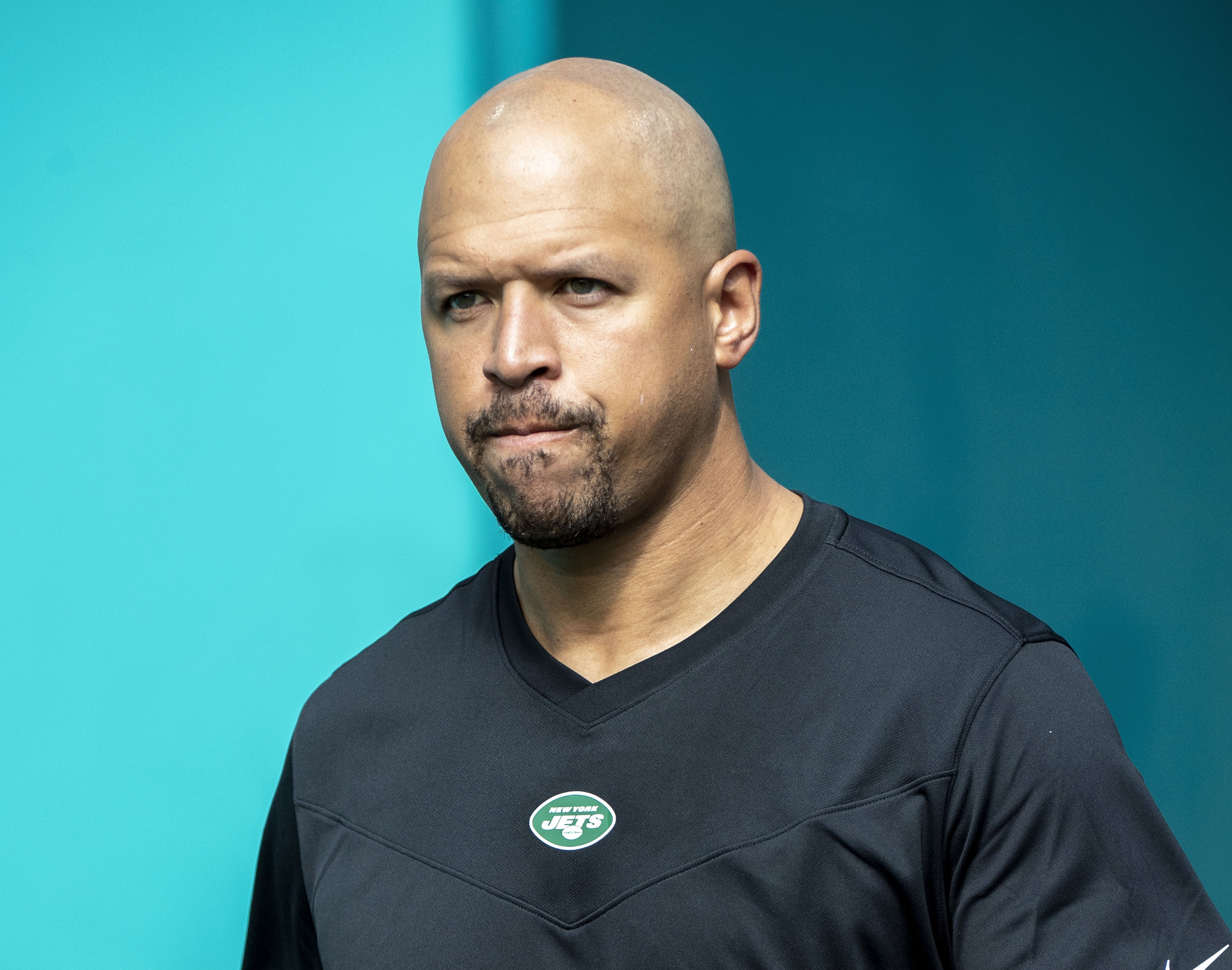 FILE - New York Jets wide receivers coach Miles Austin walks onto the field before an NFL football game against the Miami Dolphins, Dec. 19, 2021, in Miami Gardens, Fla. Austin has been suspended by the NFL for violating the league's gambling policy. NFL spokesman Brian McCarthy confirmed Friday, Dec. 23, 2022, the suspension, which Austin is appealing. 