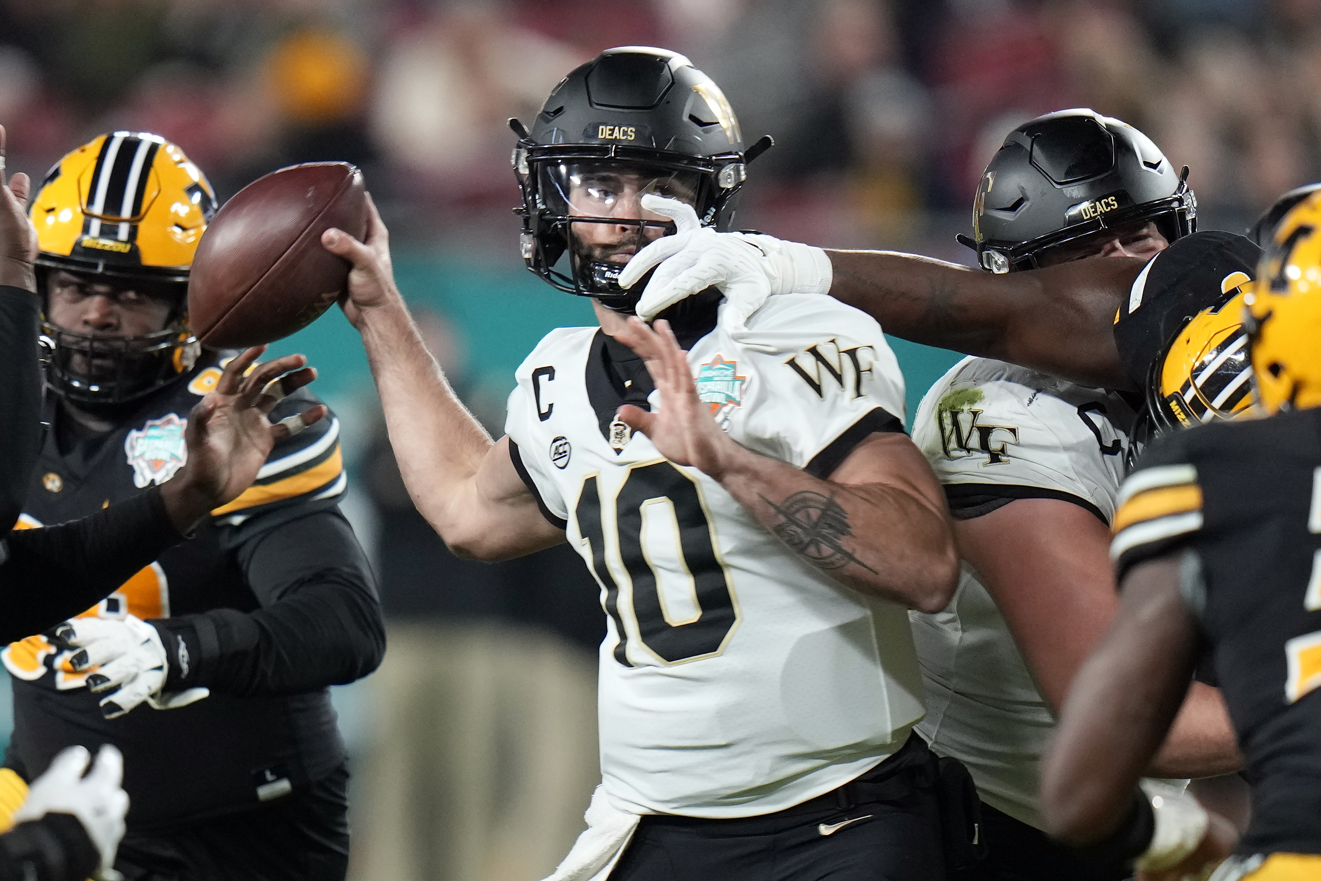 Wake Forest quarterback Sam Hartman (10) gets his pass knocked down by Missouri defensive lineman Jayden Jernigan during the first half of the Gasparilla Bowl NCAA college football game Friday, Dec. 23, 2022, in Tampa, Fla. 