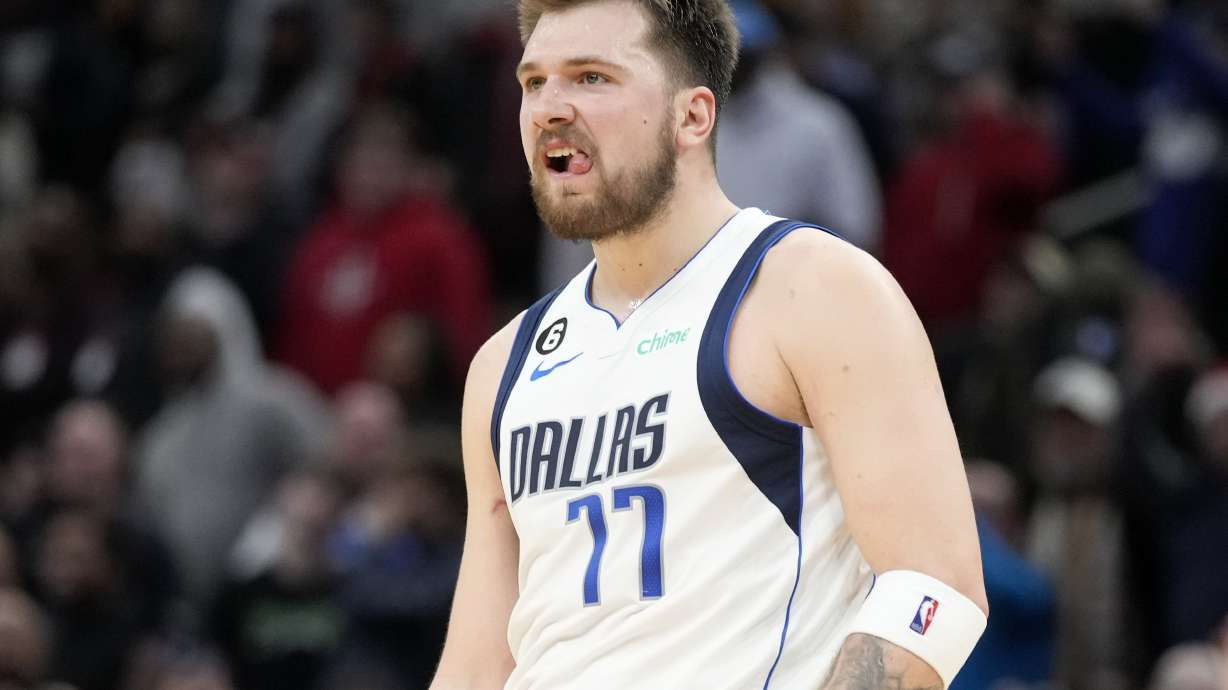 Dallas Mavericks guard Luka Doncic reacts after making a 3-point basket during the second half of an NBA basketball game against the Houston Rockets, Friday, Dec. 23, 2022, in Houston.