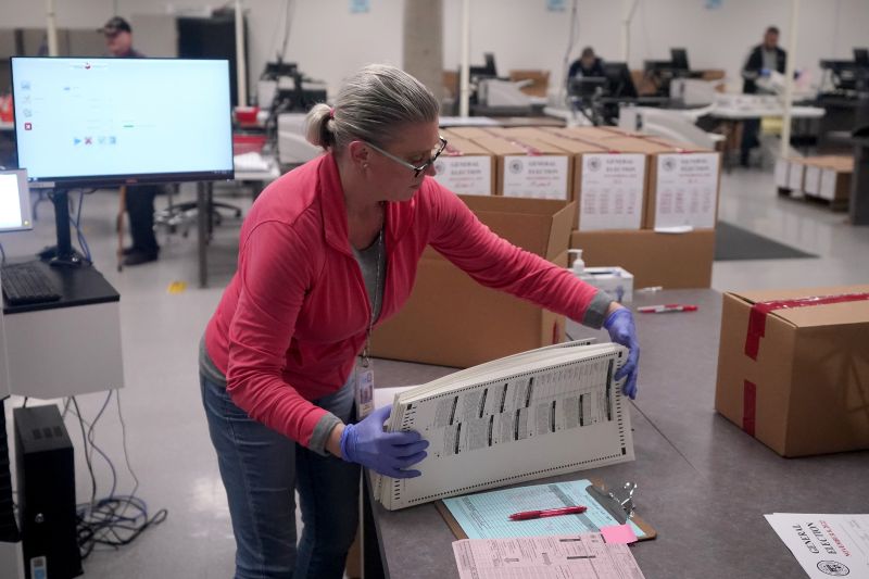 An election worker boxes tabulated ballots inside the Maricopa County Recorders Office, Nov. 9, in Phoenix.
