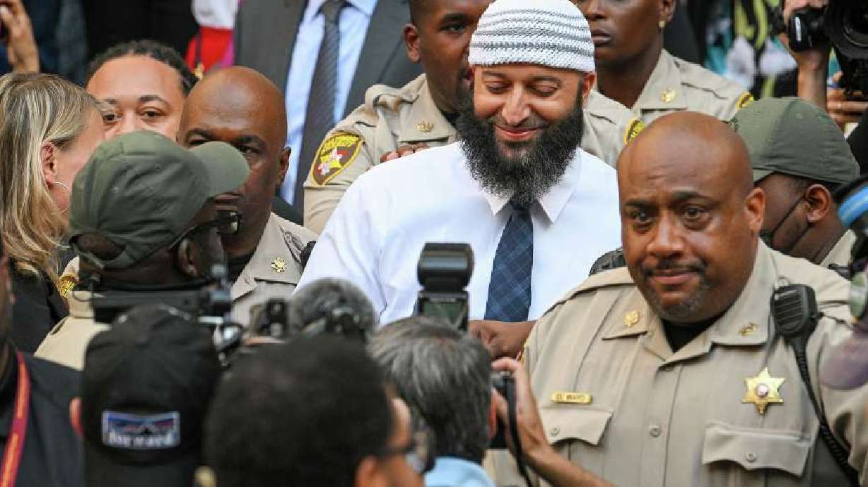 Adnan Syed, center, the man whose legal saga spawned the hit podcast "Serial," exits the Cummings Courthouse a free man after a Baltimore judge overturned his conviction for the 1999 murder of high school student Hae Min Lee, in Baltimore on Sept. 19.