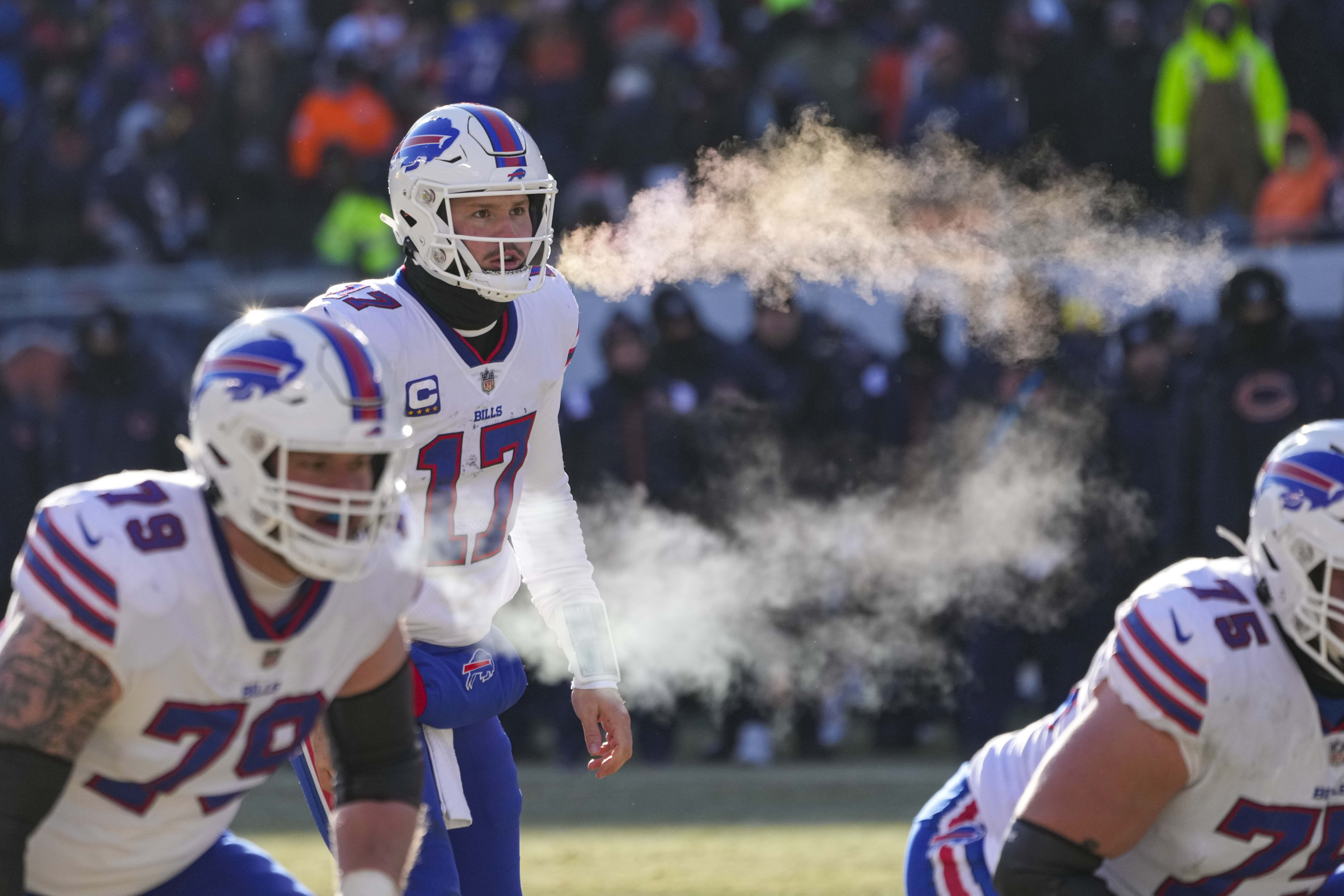 Buffalo Bills quarterback Josh Allen (17) and tackle Spencer Brown (79) exhale before a successful two-point attempt in the second half of an NFL football game against the Chicago Bears in Chicago, Saturday, Dec. 24, 2022. 