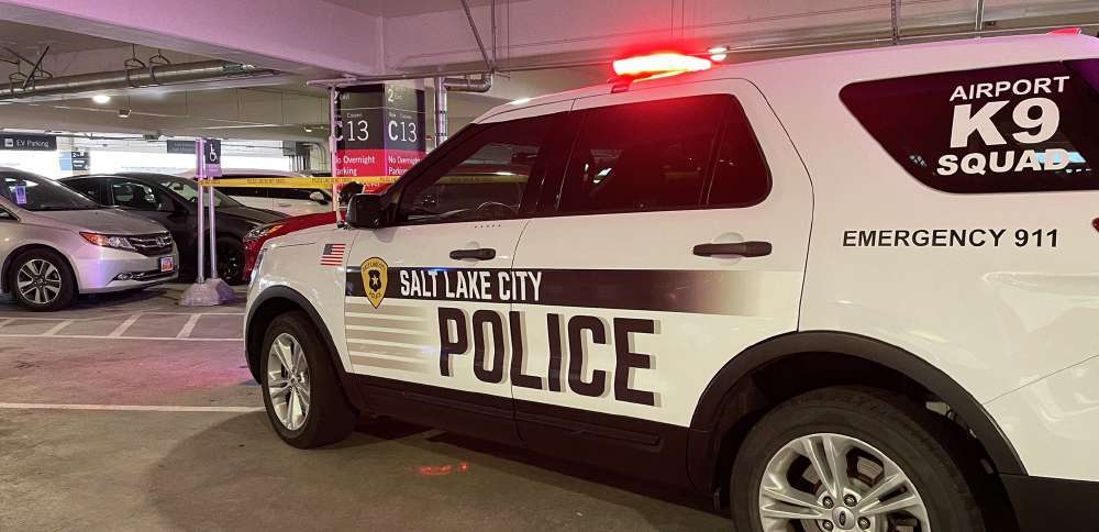 A woman died and her husband has been arrested and accused of running her over at the Salt Lake City International Airport after they returned from a vacation April 4.