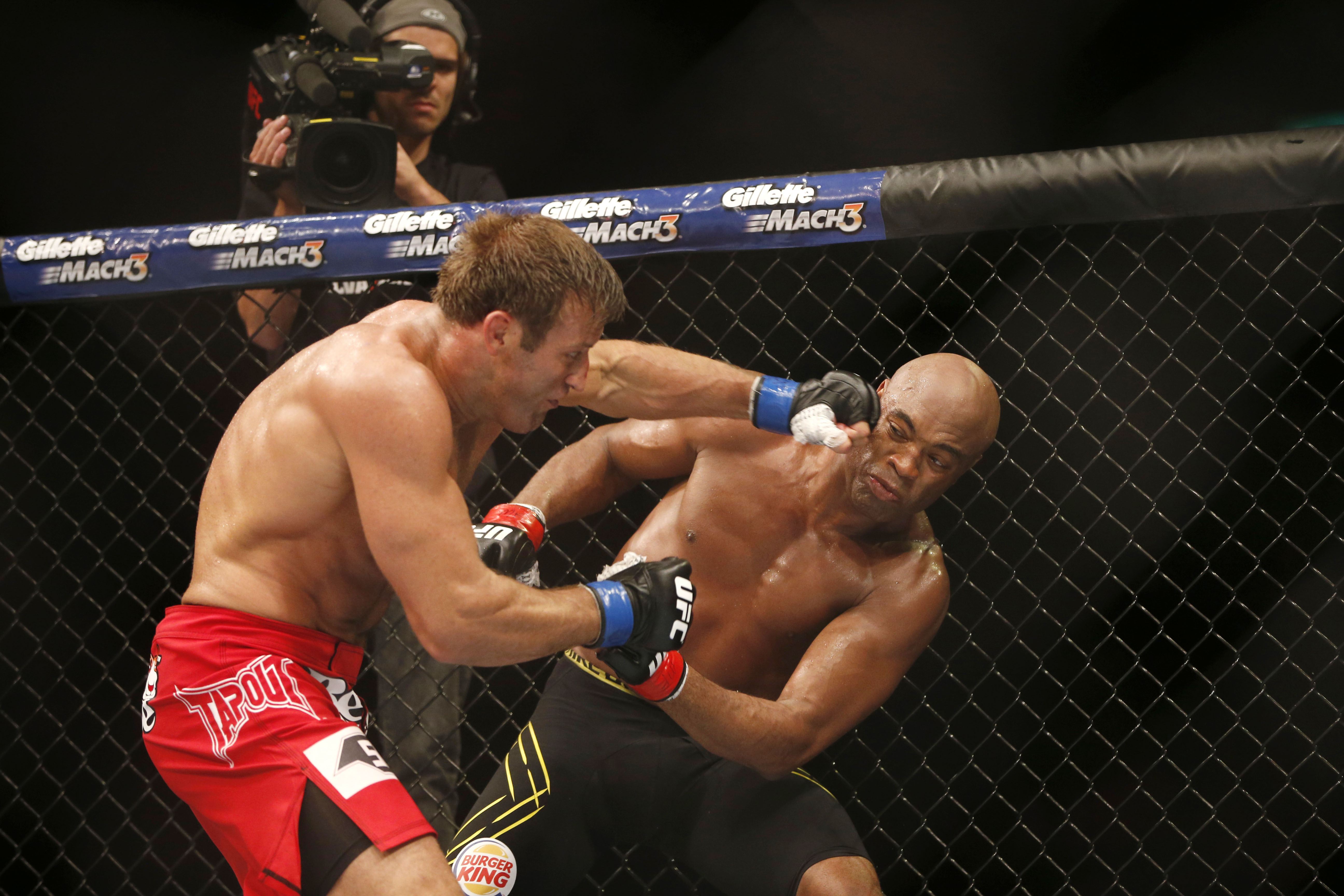 FILE - Anderson Silva, right, of Brazil, fights Stephan Bonnar, of the United States, during their light heavyweight mixed martial arts bout at the Ultimate Fighting Championship (UFC) 153 in Rio de Janeiro, Oct. 14, 2012. UFC says former fighter Bonnar, who played a significant role in the UFC’s growth into the dominant promotion in mixed martial arts, has died. The UFC Hall of Famer was 45. UFC announced in a statement that Bonnar died Thursday, Dec. 22, 2022, from “presumed heart complications while at work.” 