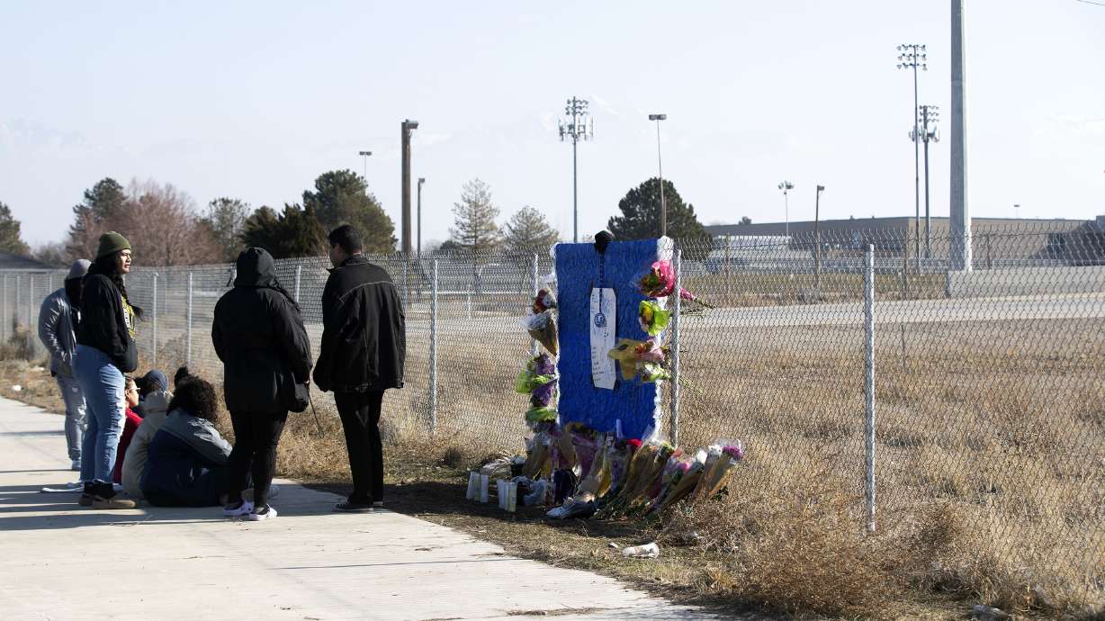 Friends and family members of 15-year-old Paul Tahi and 14-year-old Tivani Lopati gather at a memorial in their honor in West Valley on Jan. 14.