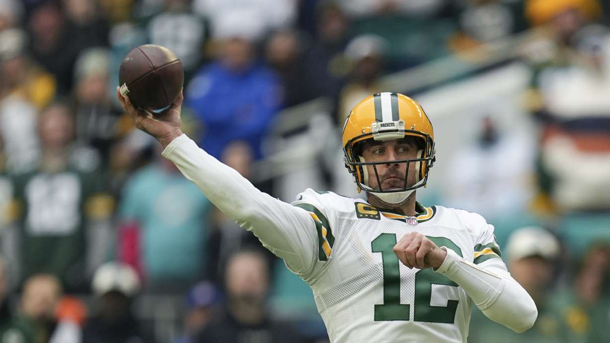 Green Bay Packers quarterback Aaron Rodgers (12) passes during the first half of an NFL football game against the Miami Dolphins, Sunday, Dec. 25, 2022, in Miami Gardens, Fla.
