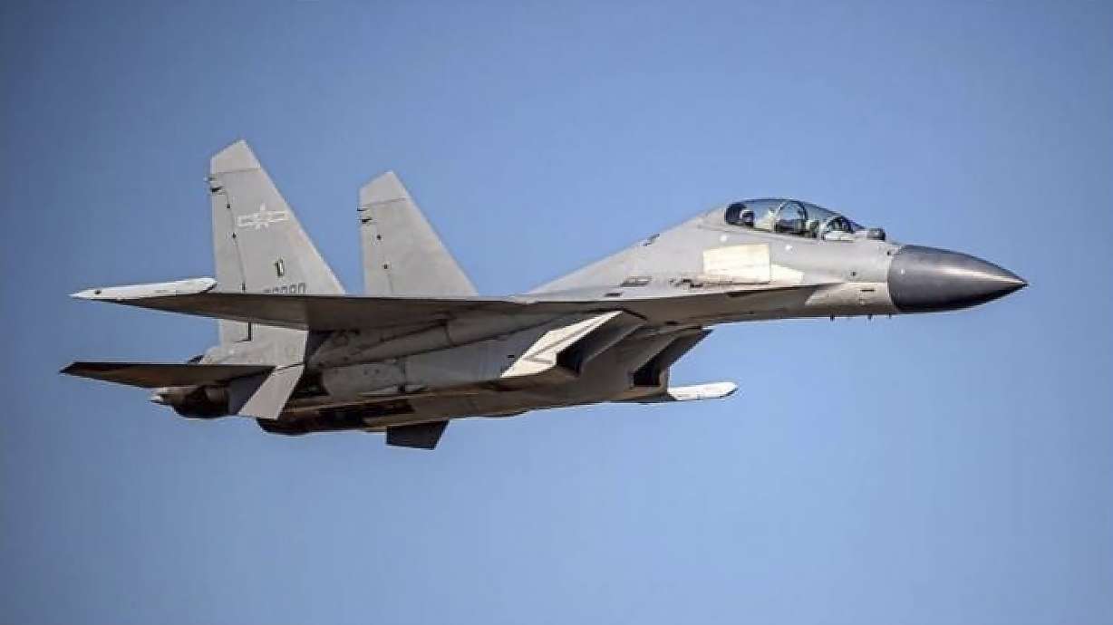 In this undated file photo released by the Taiwan Ministry of Defense, a Chinese PLA J-16 fighter jet flies in an undisclosed location. China’s military sent 71 planes, including J16 fighter jets, and seven ships toward Taiwan in a 24-hour display of force.