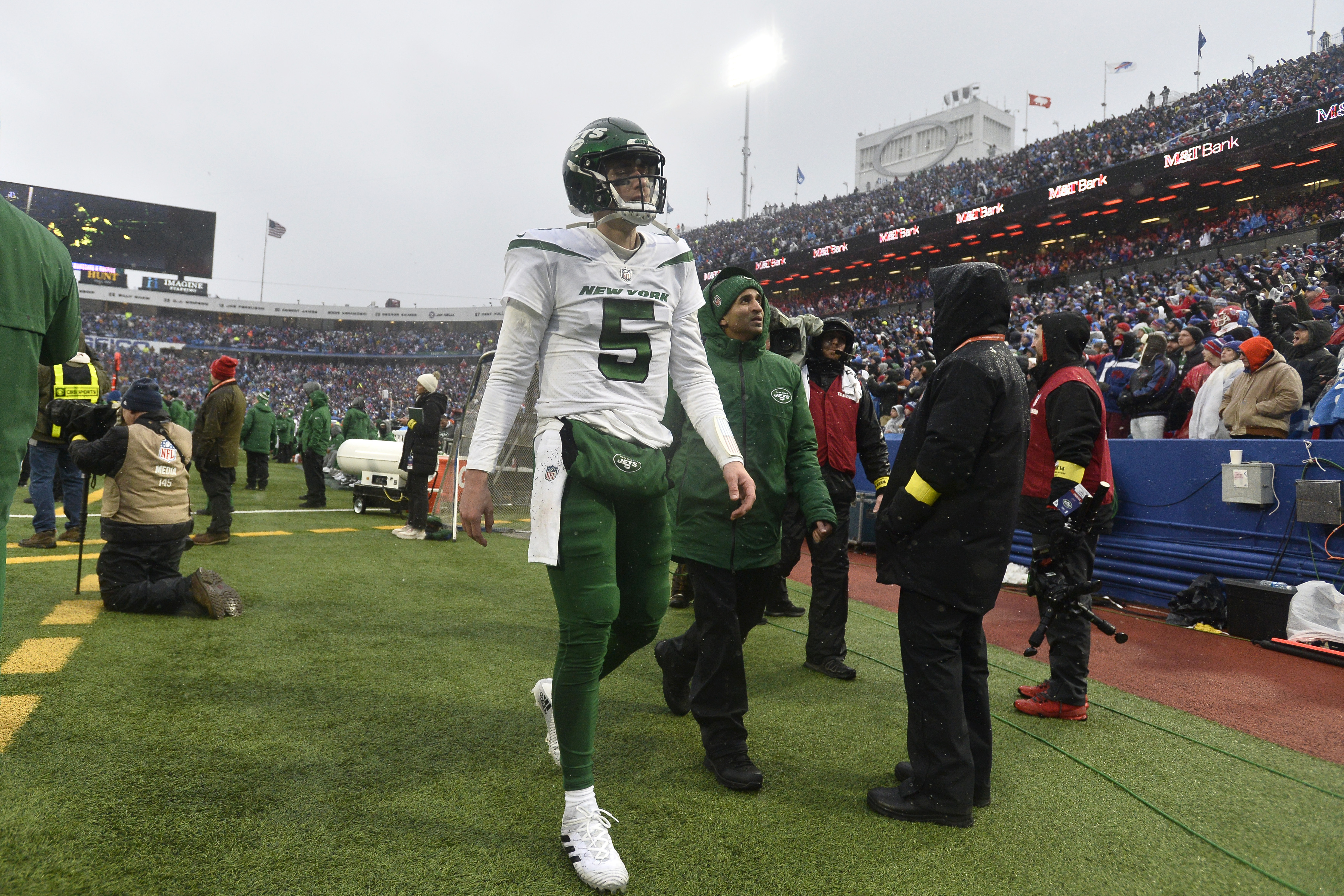 New York Jets quarterback Mike White (5) walks to the locker room during the second half of an NFL football game against the Buffalo Bills, Sunday, Dec. 11, 2022, in Orchard Park, N.Y. As a precaution, Jets head coach Robert Saleh said White was sent to the hospital after the game to be evaluated. 