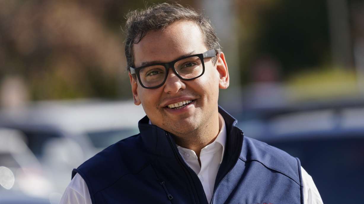 Republican candidate for New York's 3rd Congressional District George Santos campaigns outside a Stop and Shop store, Nov. 5, in Glen Cove, N.Y. Santos has admitted that he lied about his job experience and college education during his successful campaign for a seat in the U.S. House.
