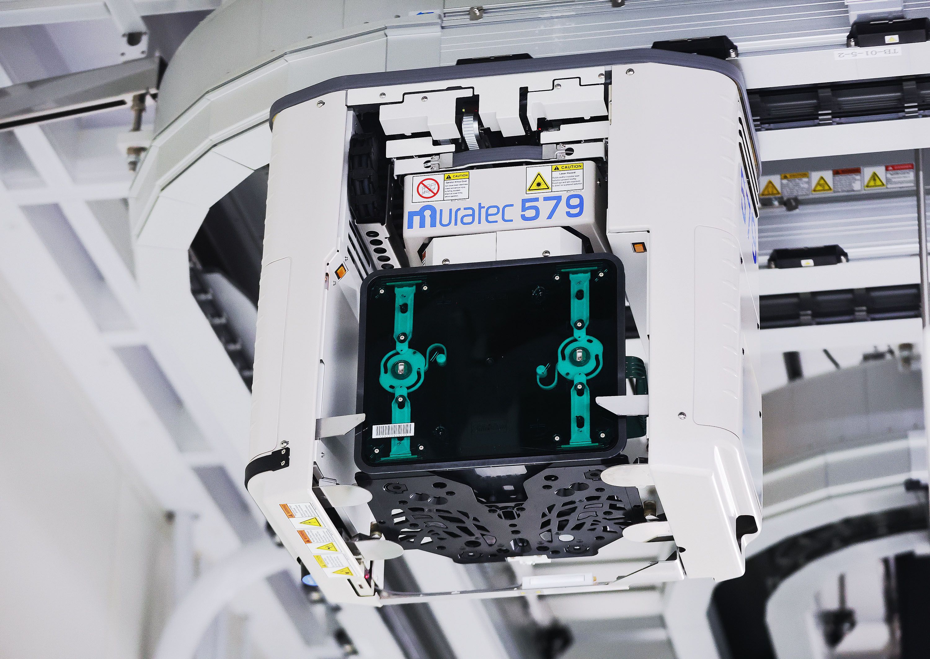 An overhead transport moves wafers at Texas Instruments’ newly renovated microchip fabrication plant in Lehi on Dec. 14.