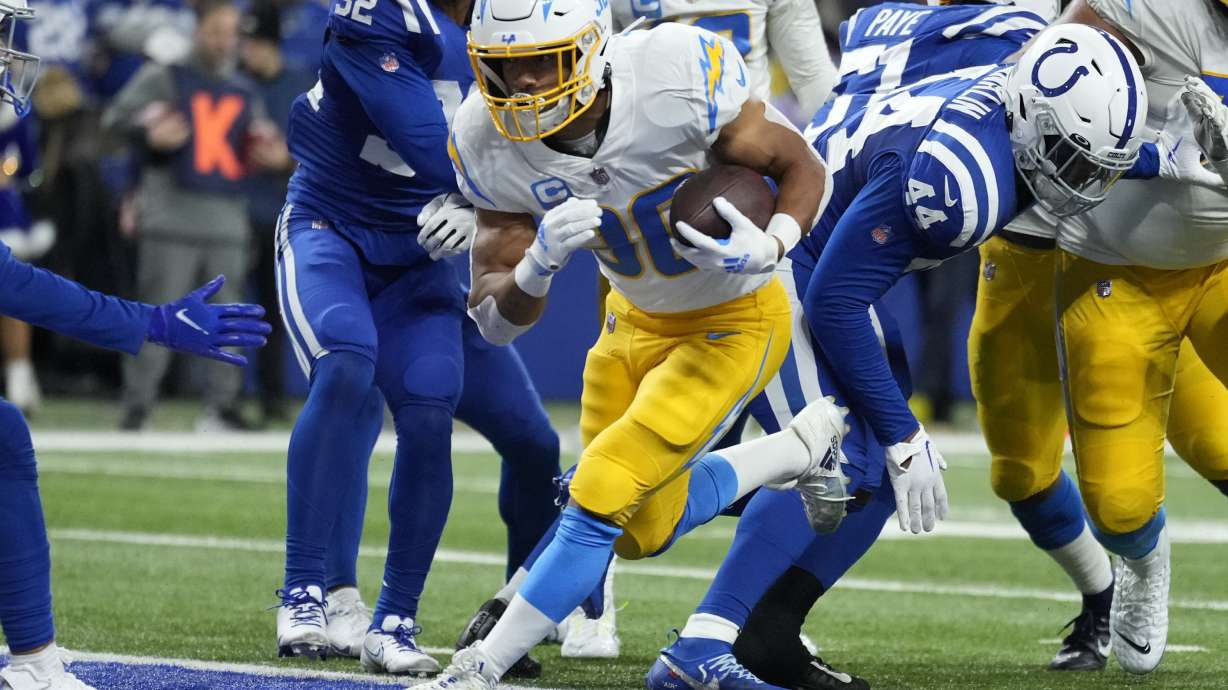 Los Angeles Chargers' Austin Ekeler (30) runs in for a touchdown during the first half of an NFL football game against the Indianapolis Colts, Monday, Dec. 26, 2022, in Indianapolis.