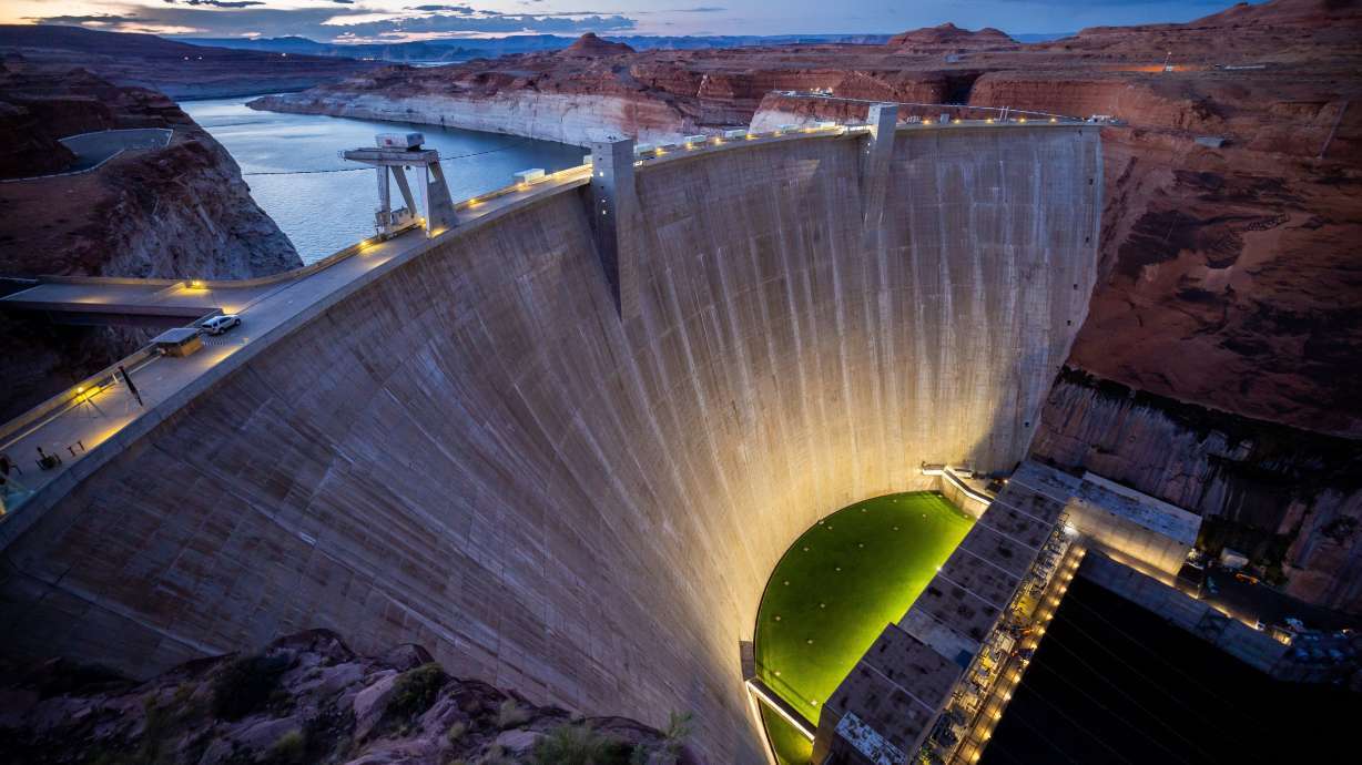 Glen Canyon Dam holds back Lake Powell in Page, Ariz., on July 18, 2022. Utah and six other Colorado River Basin states are offering a plan that could reduce river consumption by 3 million acre-feet over the next three years.