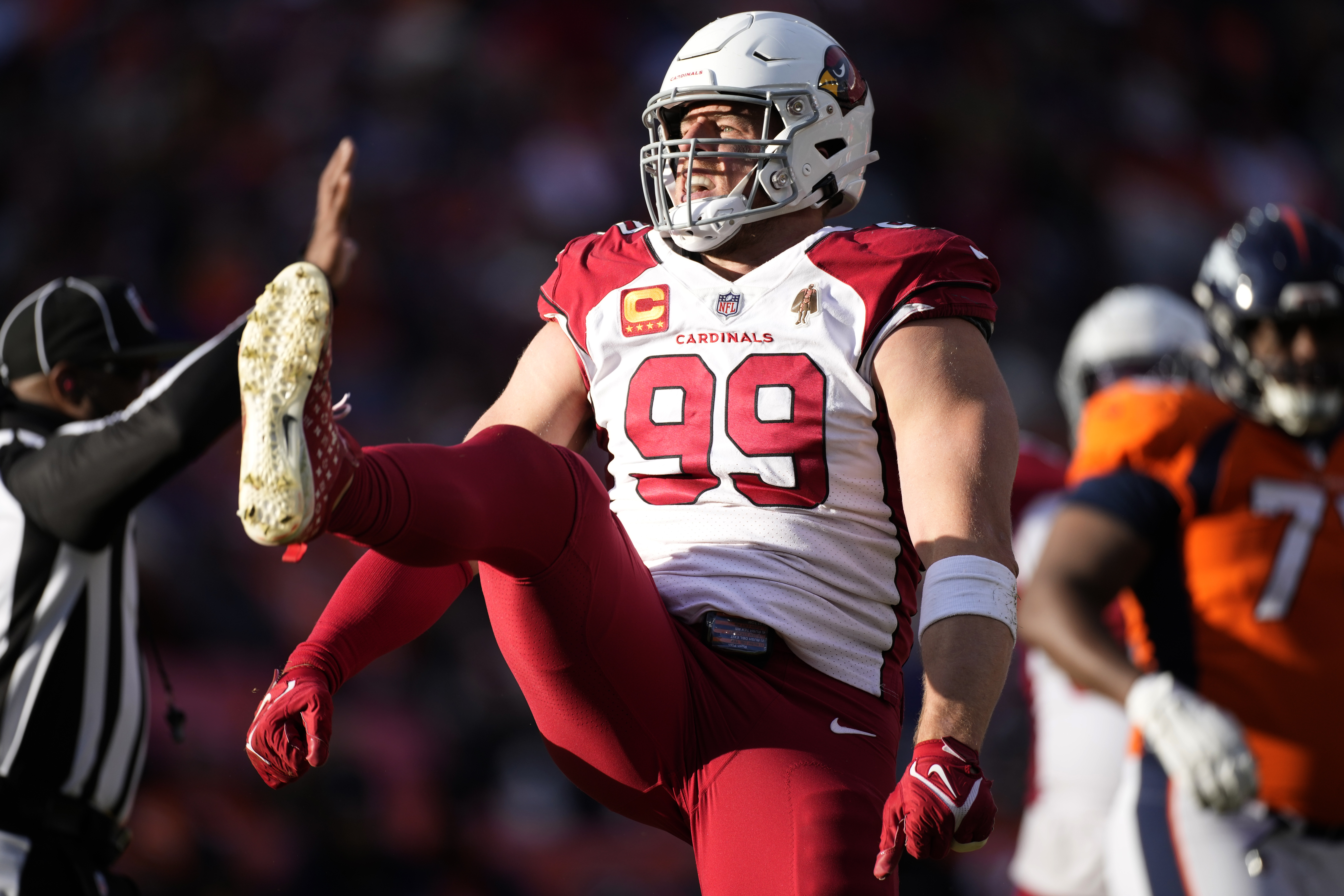 Arizona Cardinals defensive end J.J. Watt (99) celebrates his sack against the Denver Broncos during the first half of an NFL football game, Sunday, Dec. 18, 2022, in Denver. 
