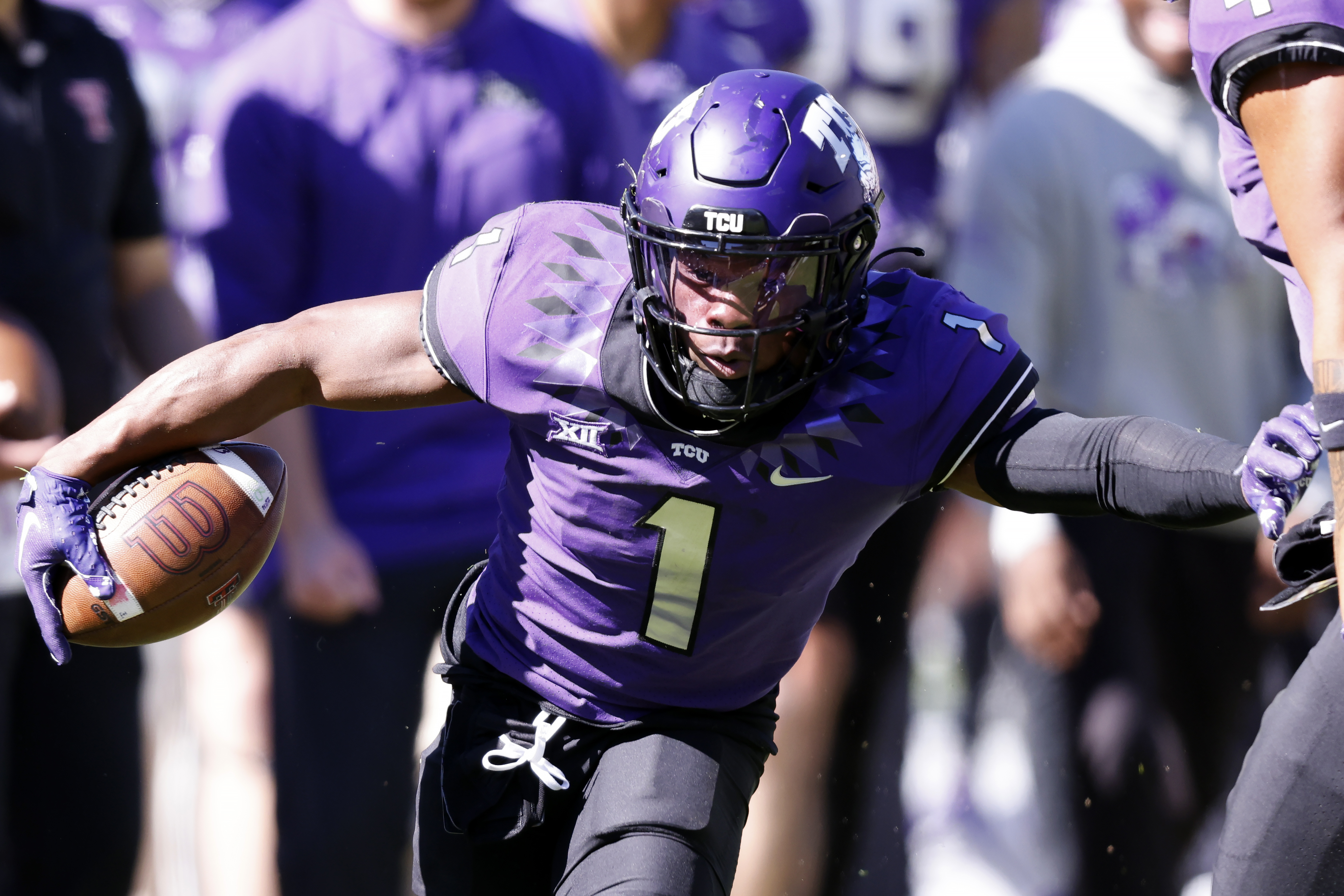 FILE - TCU cornerback Tre'Vius Hodges-Tomlinson (1) returns an interception against Texas Tech during the second half of an NCAA college football game Saturday, Nov. 5, 2022, in Fort Worth, Texas. Hodges-Tomlinson was selected to The Associated Press All-America team released Monday, Dec. 12, 2022. 