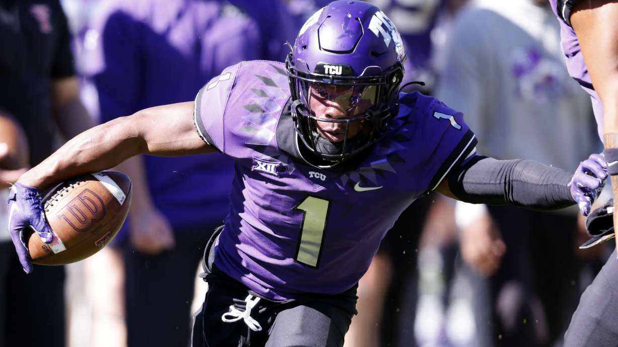 FILE - TCU cornerback Tre'Vius Hodges-Tomlinson (1) returns an interception against Texas Tech during the second half of an NCAA college football game Saturday, Nov. 5, 2022, in Fort Worth, Texas. Hodges-Tomlinson was selected to The Associated Press All-America team released Monday, Dec. 12, 2022.