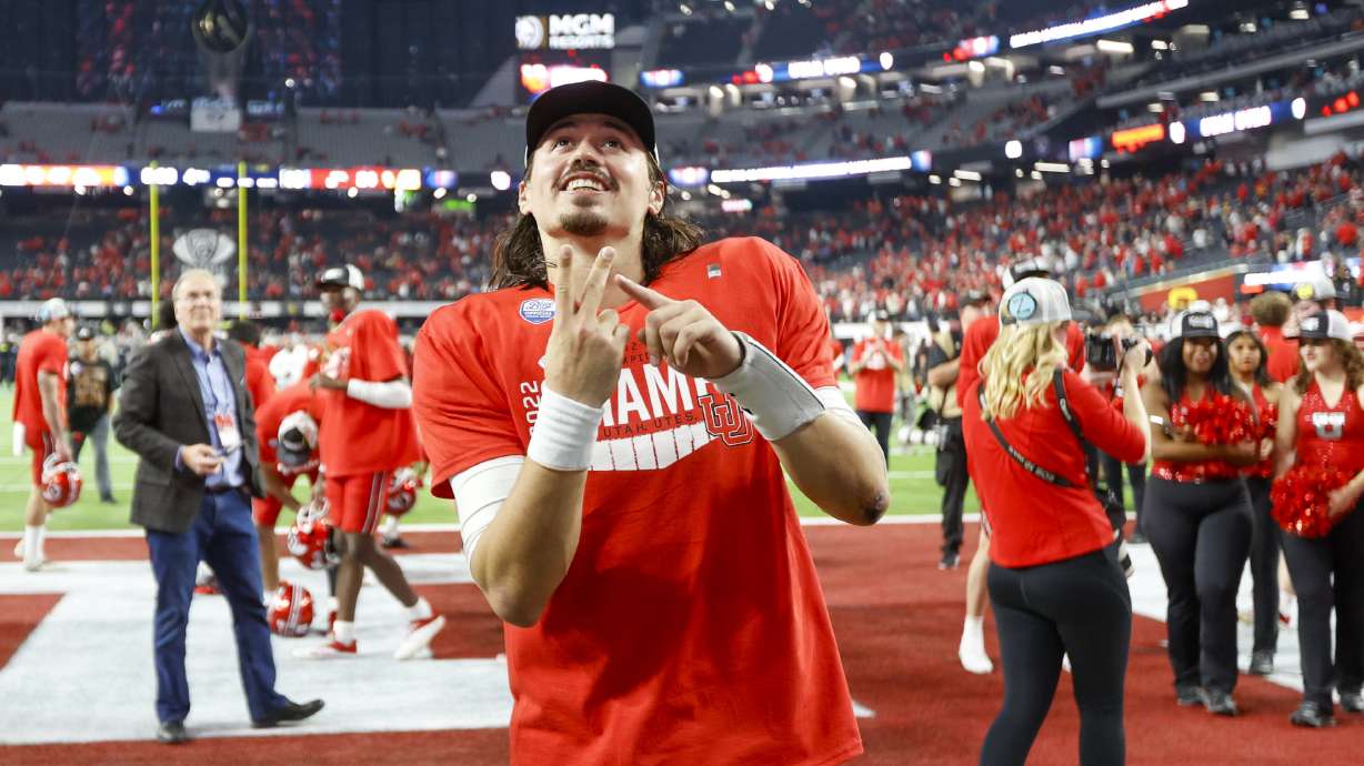 Utah Utes QB Cameron Rising celebrates beating the USC Trojans in the Pac-12 championship at the Allegiant Stadium in Las Vegas on Friday, Dec. 2, 2022. The Utes won 47-24.