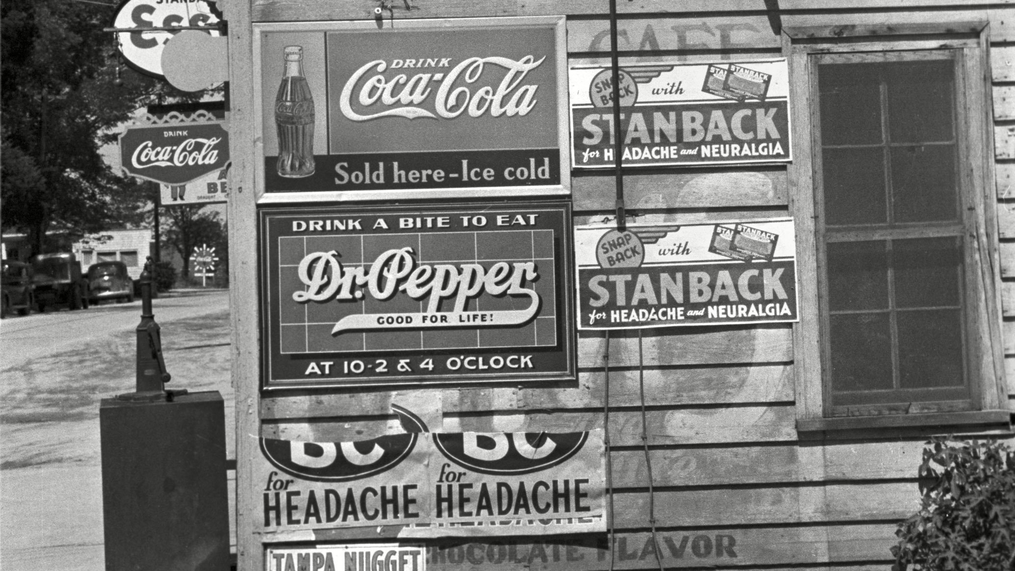Ads for Dr Pepper and Coca-Cola on a store in North Carolina, in April 1938.