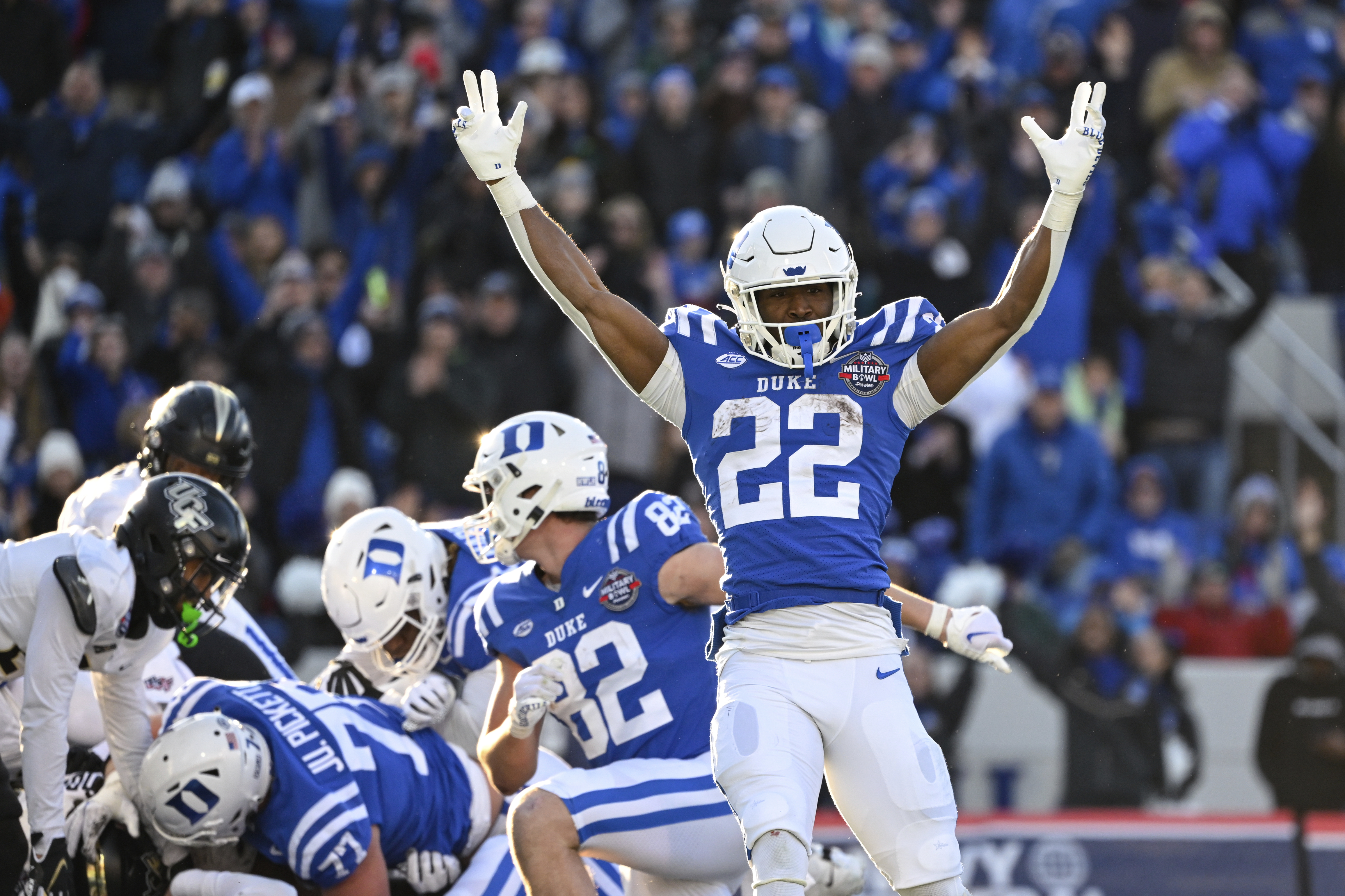Duke running back Jaylen Coleman (22) reacts to a rushing touchdown score by quarterback Riley Leonard during the first half of the Military Bowl NCAA college football game against UCF, Wednesday, Dec. 28, 2022, in Annapolis, Md. 