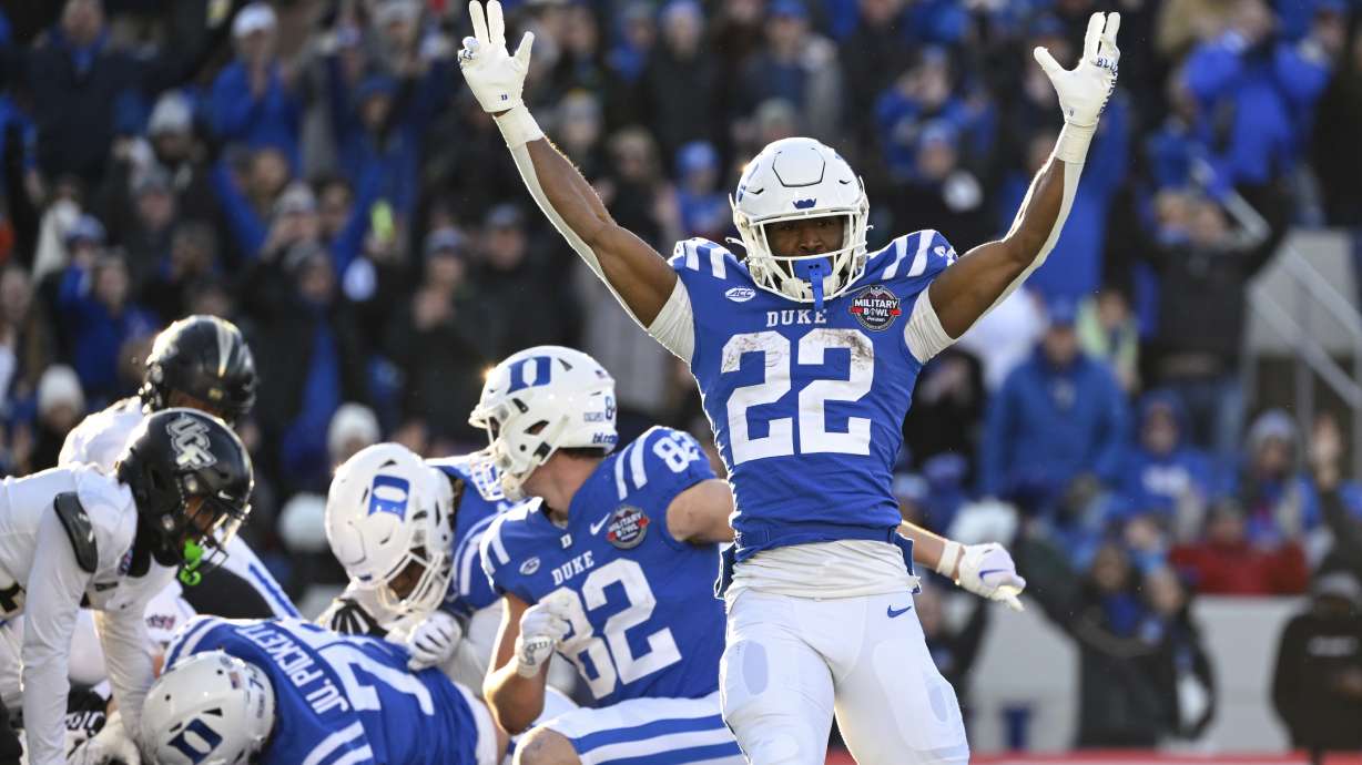 Duke running back Jaylen Coleman (22) reacts to a rushing touchdown score by quarterback Riley Leonard during the first half of the Military Bowl NCAA college football game against UCF, Wednesday, Dec. 28, 2022, in Annapolis, Md.