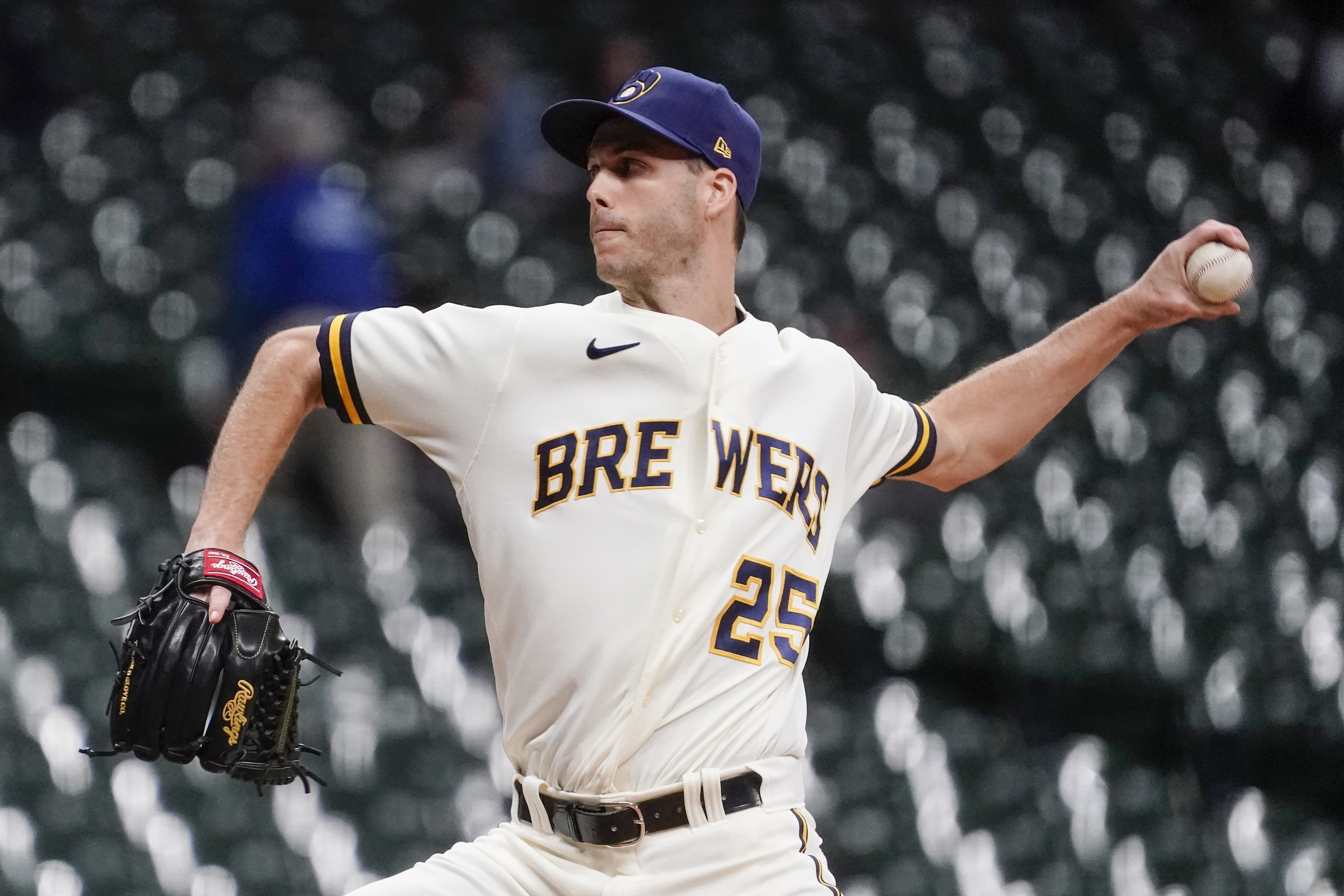 FILE -Milwaukee Brewers' Taylor Rogers throws during the eighth inning of a baseball game against the Arizona Diamondbacks Monday, Oct. 3, 2022, in Milwaukee. Left-hander Taylor Rogers is joining twin brother Tyler as a reliever with the San Francisco Giants, agreeing to a $33 million, three-year contract, Wednesday, Dec. 28, 2022. 
