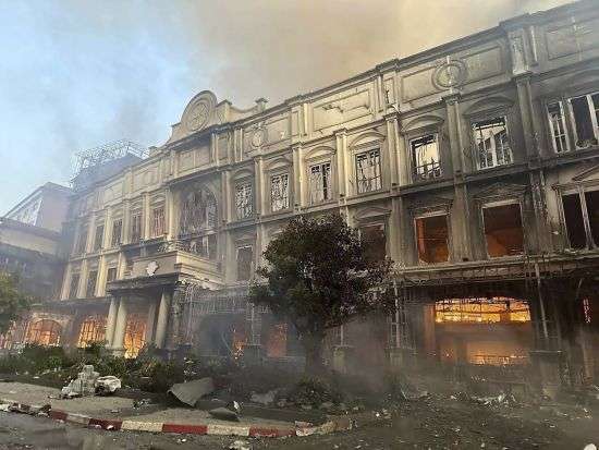 A building burns near a Cambodia-Thai international border gate in Poipet, west of Phnom Penh, Cambodia, Wednesday. A fire burning through the Grand Diamond City Casino and Hotel has killed multiple people and injured dozens of others, police said Thursday.