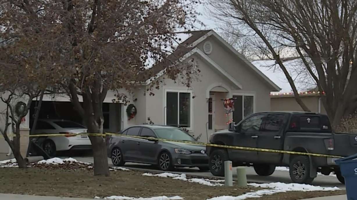 Police respond to a shooting at a Payson home on Dec. 22. A woman accused of breaking into her estranged husband's home and shooting another woman inside was released from a hospital and booked into jail Wednesday.