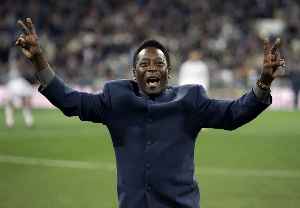 Brazil's soccer legend Pele greets the crowd ahead of a Spanish league soccer match, in the Santiago Bernabeu stadium in Madrid, Jan. 16, 2005. Pelé, the Brazilian king of soccer who won a record three World Cups and became one of the most commanding sports figures of the last century, died in Sao Paulo on Thursday. He was 82.
