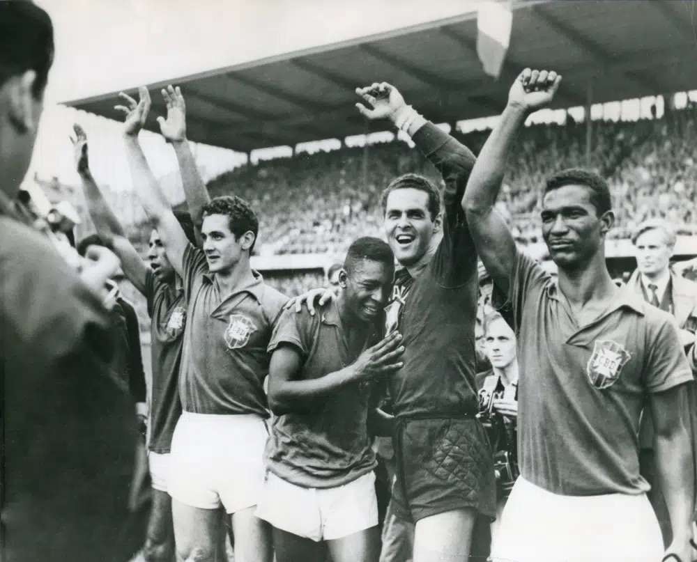 Brazil's 17-year-old Pele weeps on the shoulder of goalkeeper Gylmar Dos Santos Neves after Brazil's 5-2 victory over Sweden in the final of the soccer World Cup in Stockholm, Sweden, June 29, 1958. Pelé, the Brazilian king of soccer who won a record three World Cups and became one of the most commanding sports figures of the last century, died in Sao Paulo on Thursday. He was 82.