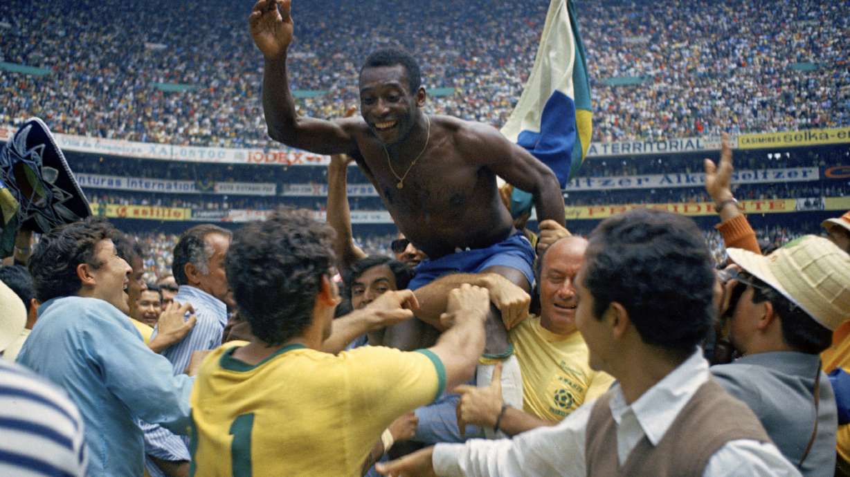 FILE - Brazil's Pele is hoisted on the shoulders of his teammates after Brazil won the World Cup final against Italy, 4-1, in Mexico City's Estadio Azteca, June 21, 1970. Pelé, the Brazilian king of soccer who won a record three World Cups and became one of the most commanding sports figures of the last century, died in sao Paulo on Thursday, Dec. 29, 2022. He was 82.