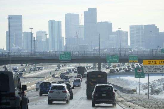 The skyline of downtown is shrouded after a winter storm swept over the country on Dec. 23 in Denver. More than 1,100 cities, towns and villages in the U.S. lost their status as urban areas on Thursday as the U.S. Census Bureau released a new list of places considered urban based on revised criteria.