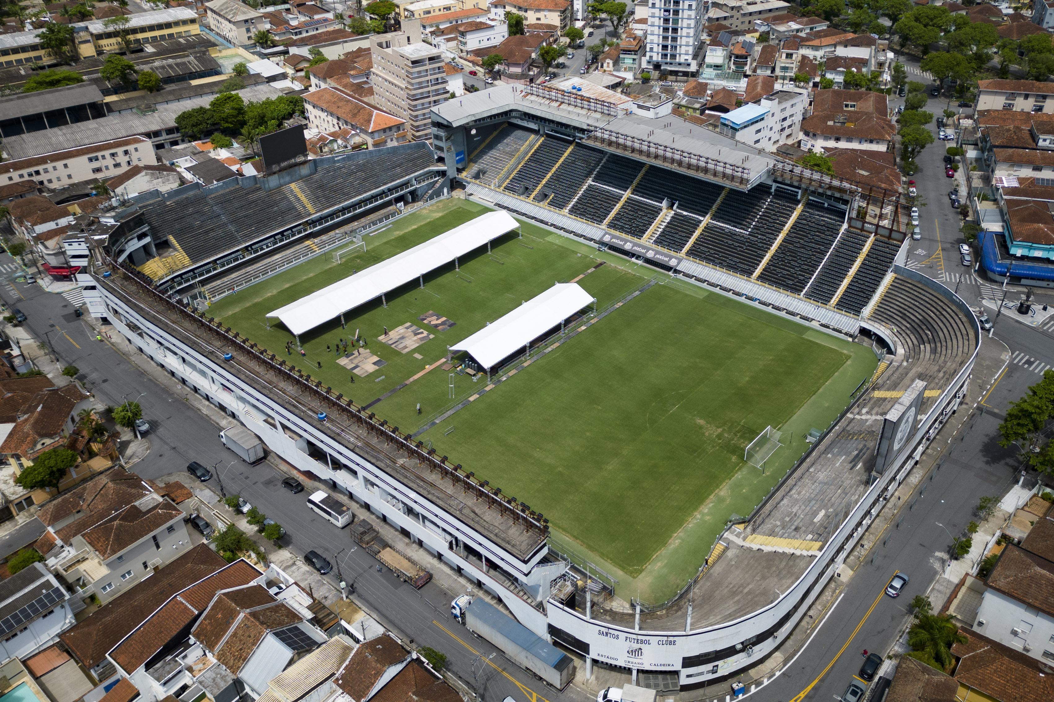 Workers set up tents at the Vila Belmiro stadium, the home of the Santos FC soccer club where soccer legend Pele played most of his career, in Santos, Brazil, Sunday, Dec. 25, 2022. 
