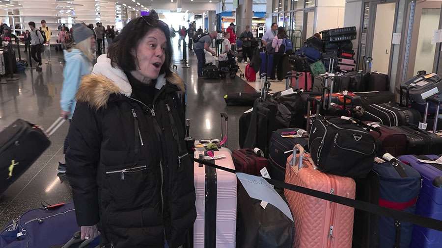 Donna Stackman picks up her lost luggage at Salt Lake City International Airport on Thursday.