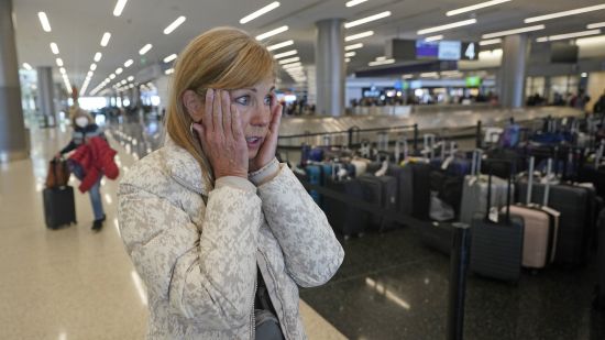 Chicago traveler Shana Schifer reacts after receiving her bags that had been lost since Christmas Day at the Southwest Airlines unclaimed baggage area at Salt Lake City International Airport Thursday in Salt Lake City.