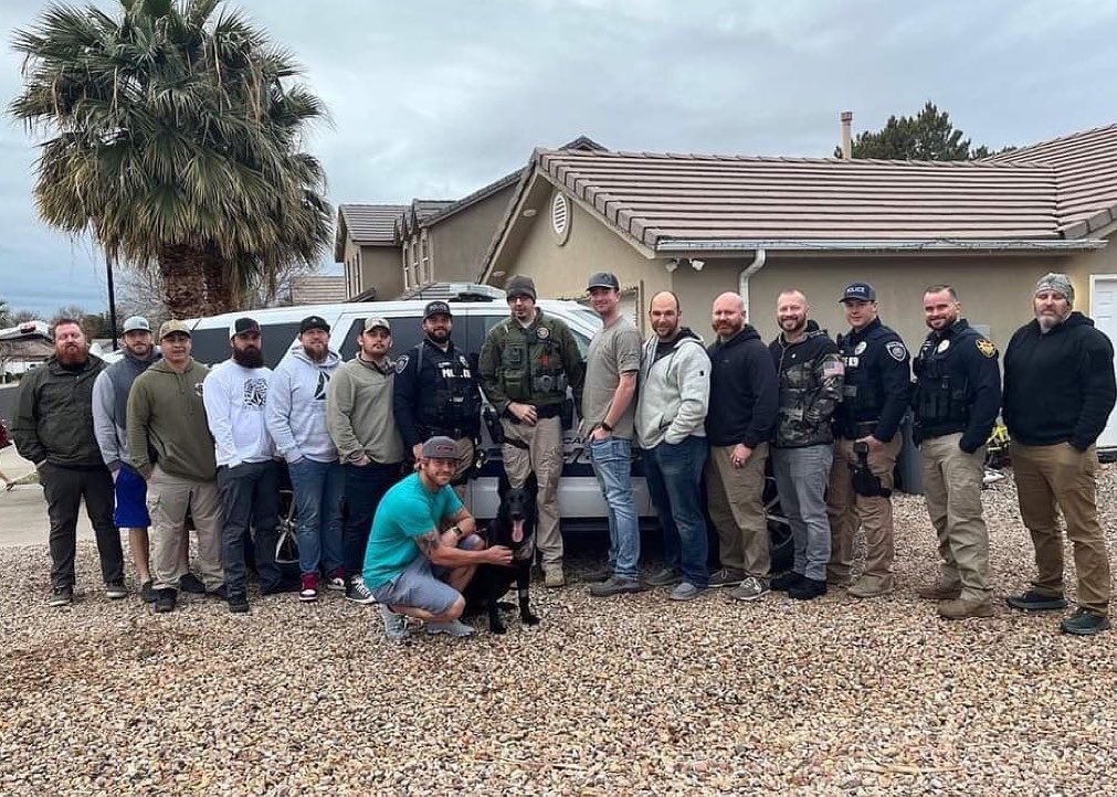 Hurricane police K-9 Rico — pictured with his handler, officer Eric DeMille, and K-9 handlers from throughout Washington County — is back in Utah recovering after being stabbed in the neck on Monday.