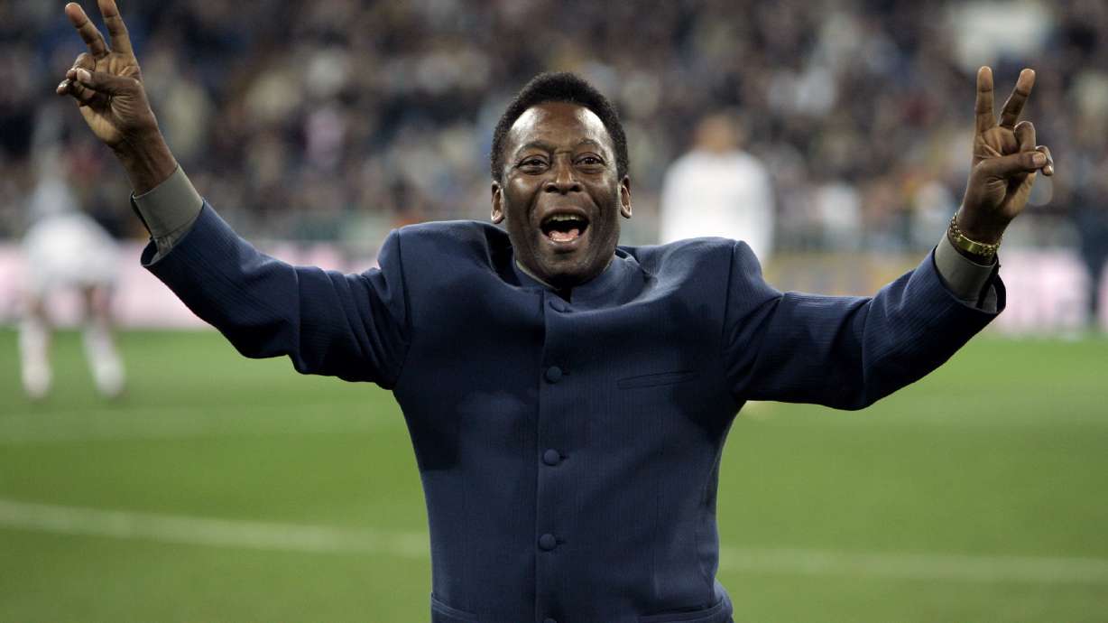 FILE - Brazil's soccer legend Pele greets the crowd ahead of a Spanish league soccer match, in the Santiago Bernabeu stadium in Madrid, Jan. 16, 2005. Pelé, the Brazilian king of soccer who won a record three World Cups and became one of the most commanding sports figures of the last century, died in Sao Paulo on Thursday, Dec. 29, 2022. He was 82.