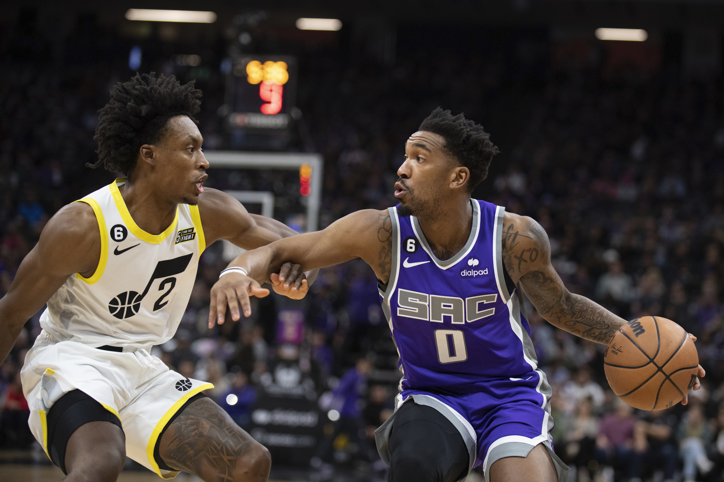 Utah Jazz guard Collin Sexton (2) defends against Sacramento Kings guard Malik Monk (0) in the first quarter in an NBA basketball game in Sacramento, Calif., Friday, Dec. 30, 2022.