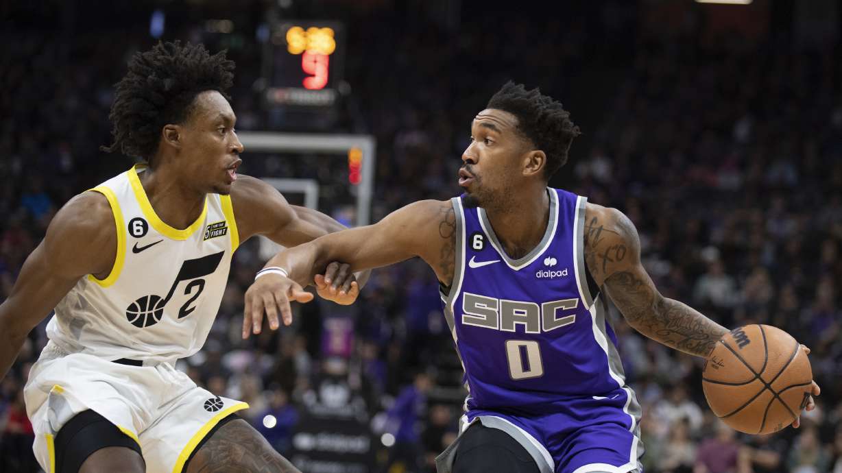Utah Jazz guard Collin Sexton (2) defends against Sacramento Kings guard Malik Monk (0) in the first quarter in an NBA basketball game in Sacramento, Calif., Friday, Dec. 30, 2022.