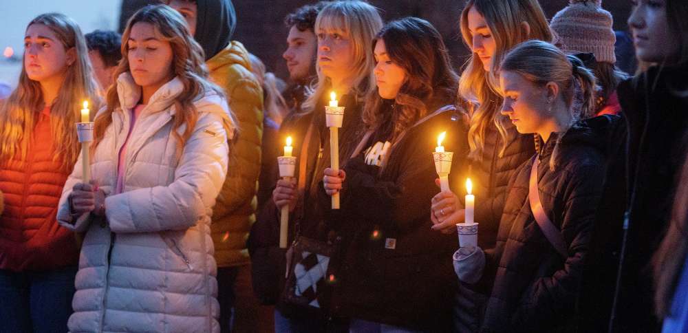 Boise State University students, along with people who knew the four University of Idaho students who were found killed in Moscow, Idaho, days earlier, pay their respects at a vigil held in front of a statue on the Boise State campus, Nov. 17 in Boise. The arrest of Bryan Christopher Kohberger in the Nov. 13 fatal stabbings of four University of Idaho students has brought relief to the small college town of Moscow, Idaho.