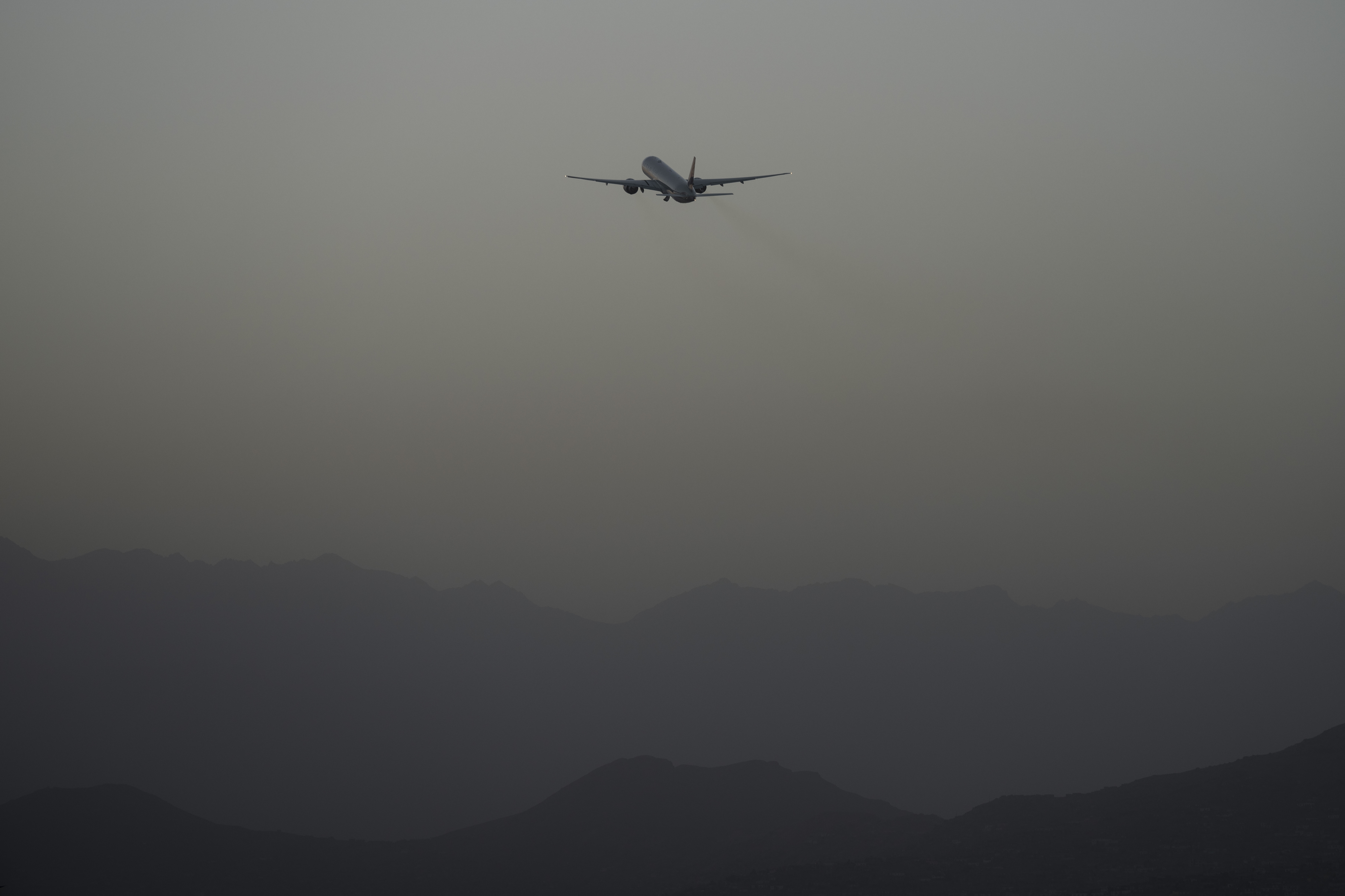 A Qatar Airways aircraft takes off with foreigners from the airport in Kabul, Afghanistan, Sept. 9, 2021. An Afghan refugee family alleges a U.S. Marine abducted their baby. But two months after an AP report on the high-stakes legal fight over the child raised alarms at the highest levels of government, from the White House to the Taliban, the baby remains with U.S Marine Corps Major Joshua Mast and his family.