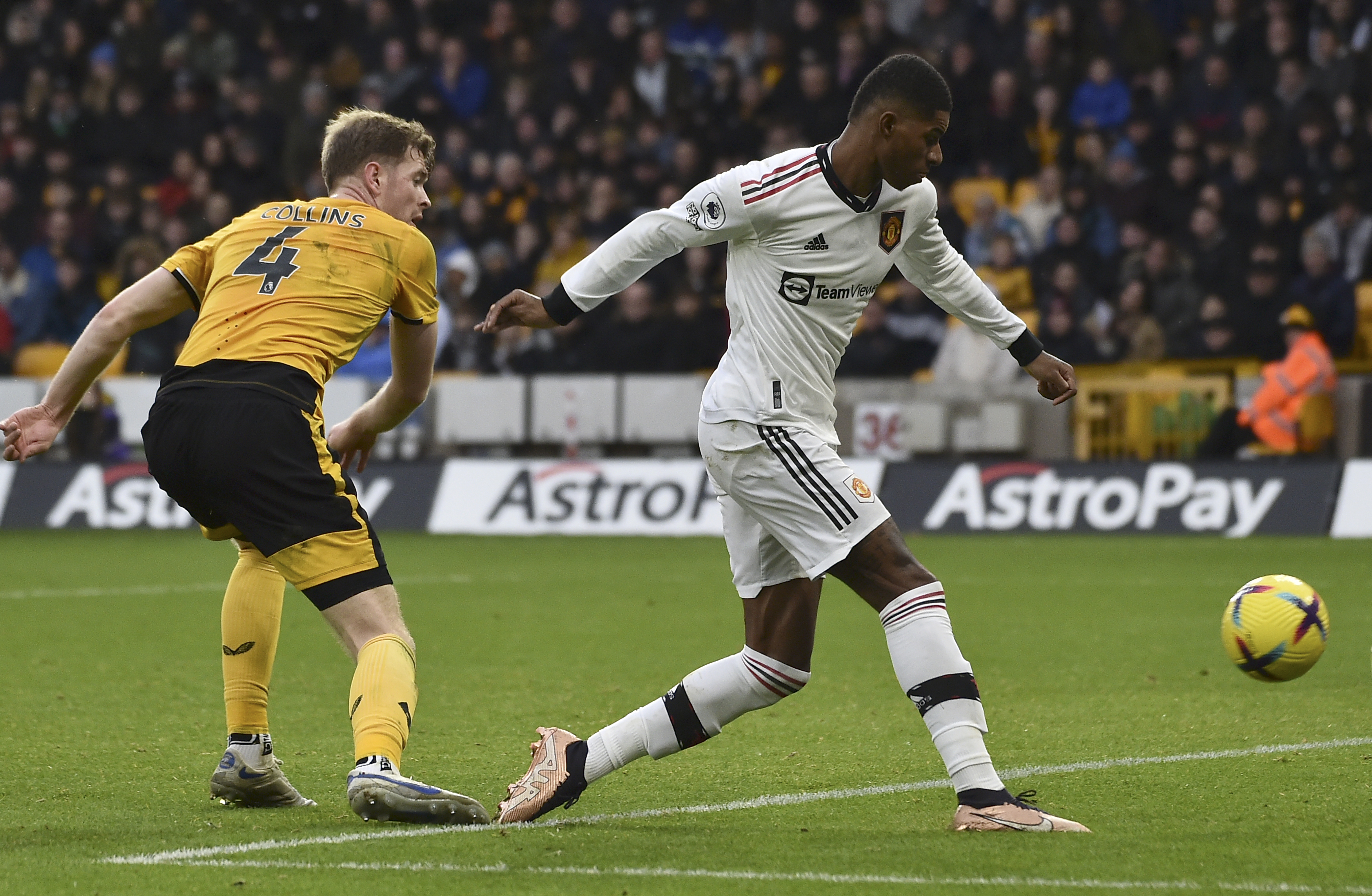 Manchester United's Marcus Rashford, right, scores a disallowed goal during the English Premier League soccer match between Wolverhampton Wanderers and Manchester United at the Molineux Stadium in Wolverhampton, England, Saturday, Dec. 31, 2022.