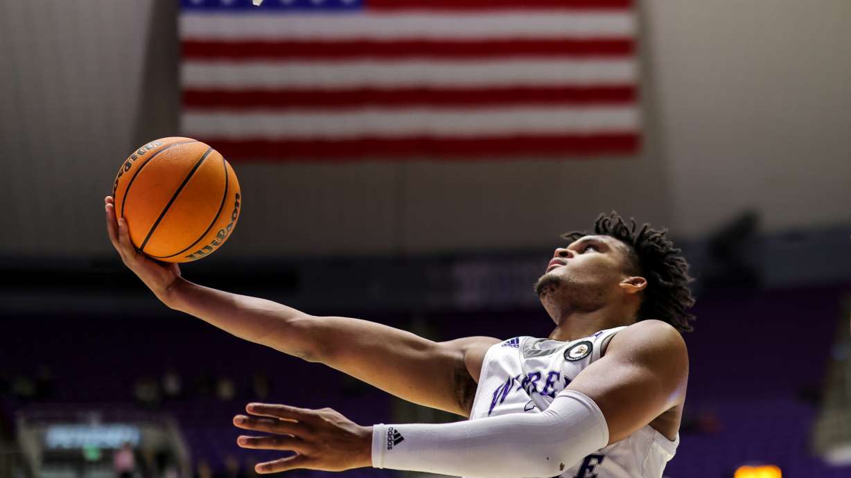 Weber State forward Dillon Jones lays up the ball in a game against Northern Arizona on Dec. 31, 2022.