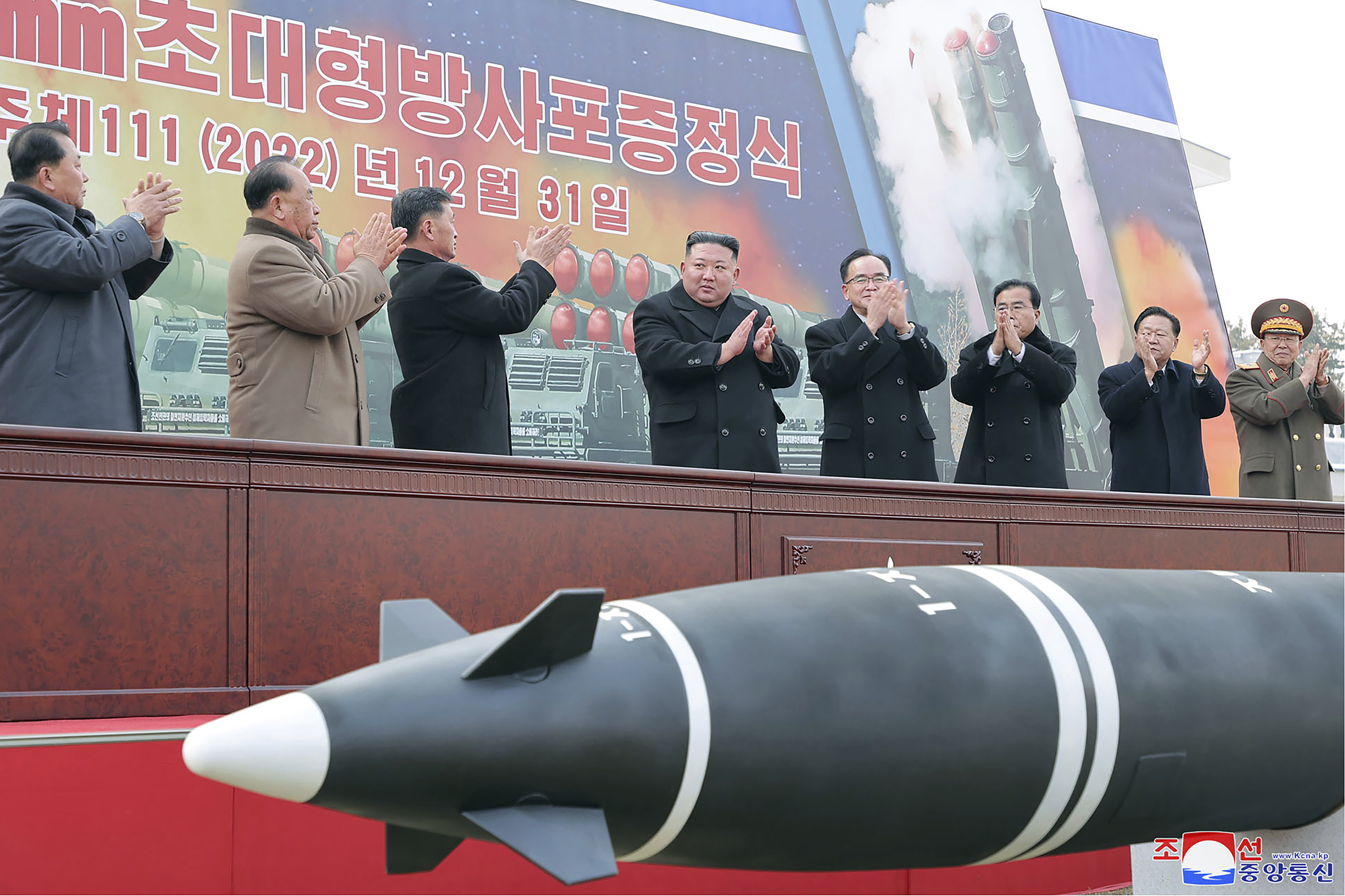 North Korean leader Kim Jong Un, center, attends a ceremony of donating 600mm super-large multiple launch rocket system at a garden of the Workers’ Party of Korea headquarters in Pyongyang, North Korea Saturday. Independent journalists were not given access to cover the event depicted in this image distributed by the North Korean government. 