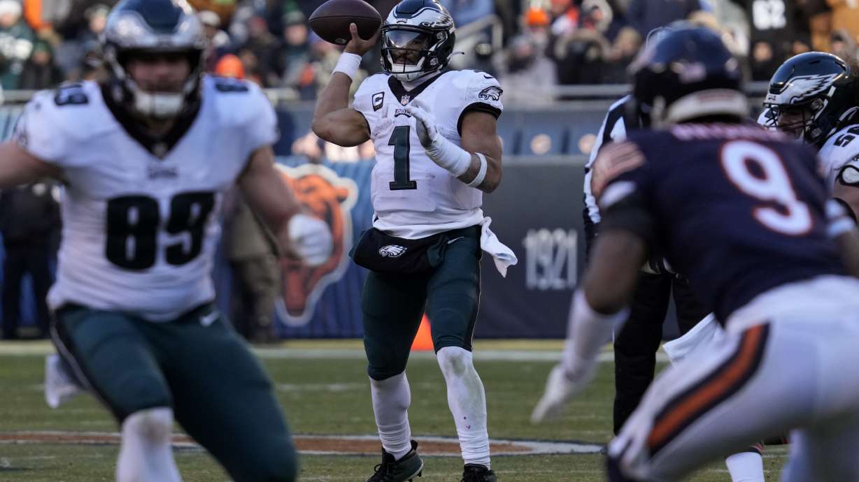 Philadelphia Eagles' Jalen Hurts passes during the second half of an NFL football game against the Chicago Bears, Sunday, Dec. 18, 2022, in Chicago.