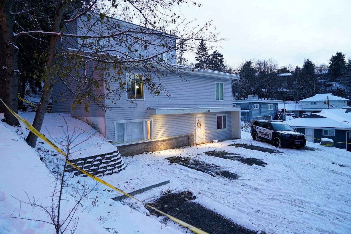 Bare spots are seen on Nov. 29, 2022, in the snowy parking lot in front of the home where four University of Idaho students were found dead on Nov. 13, in Moscow, Idaho, after vehicles belonging to the victims and others were towed away earlier in the day.