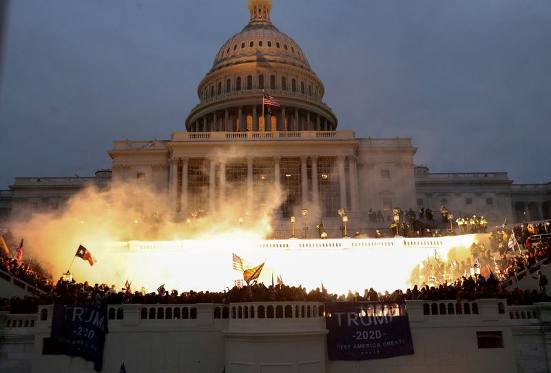 An explosion caused by a police munition is seen while supporters of President Donald Trump gather in front of the U.S. Capitol on Jan. 6, 2021. U.S. Capitol Police are prepared for any possible future attacks on Congress, its chief said Monday 
